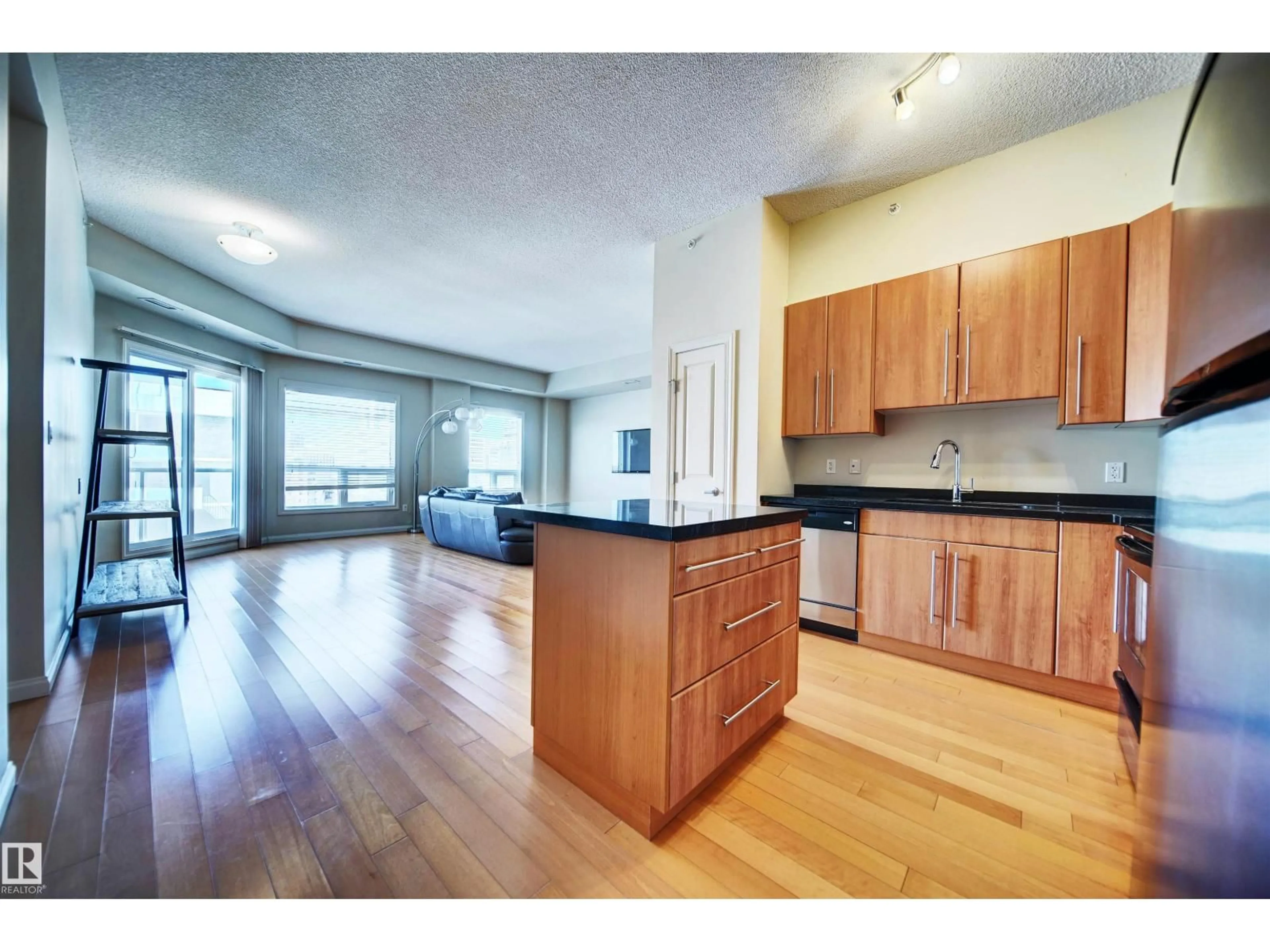 Open concept kitchen, wood/laminate floor for 9819 - 1206 104 ST, Edmonton Alberta T5K0Y8