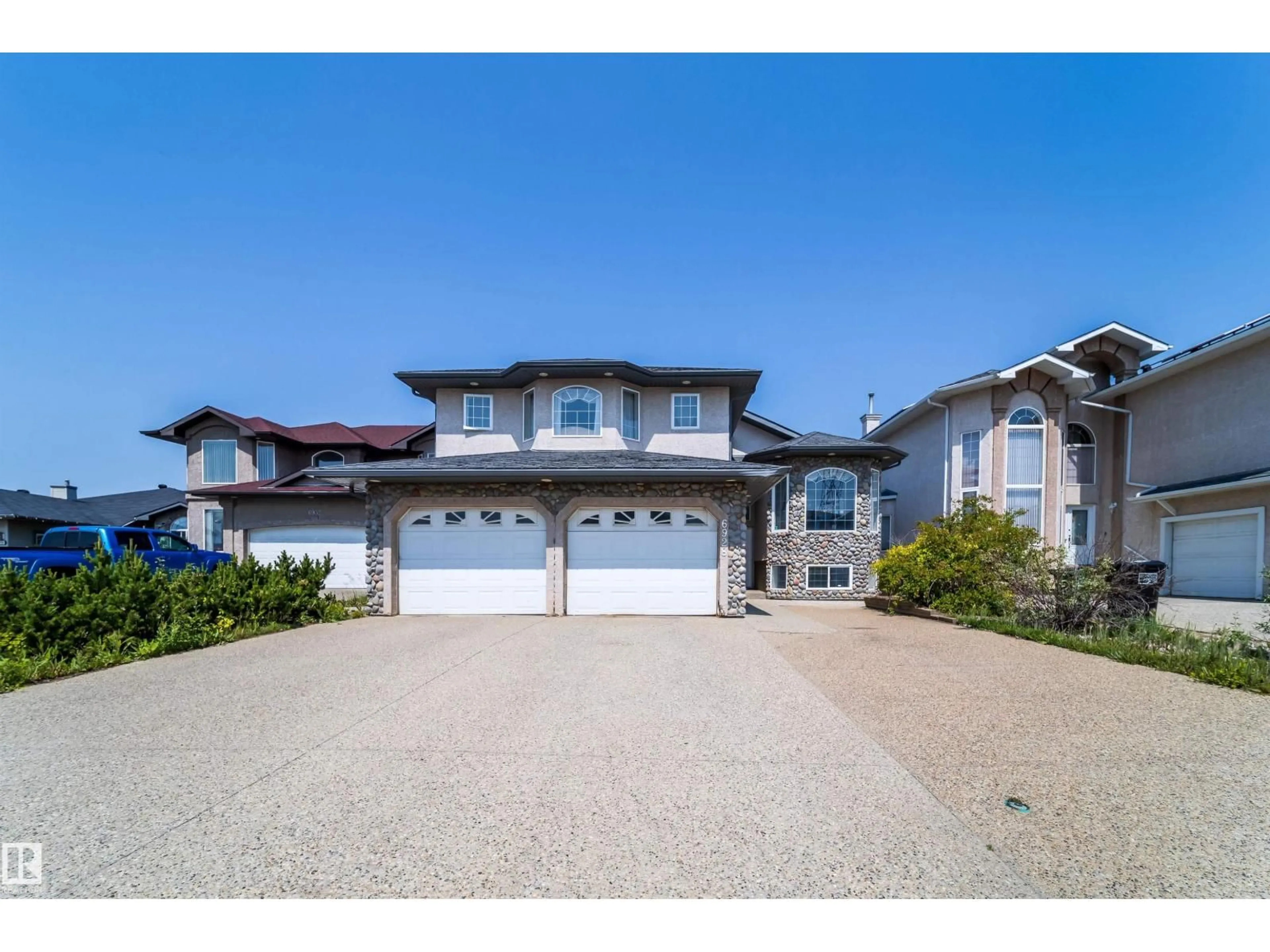 A pic from outside/outdoor area/front of a property/back of a property/a pic from drone, street for 6928 164 AV, Edmonton Alberta T5Z3R3