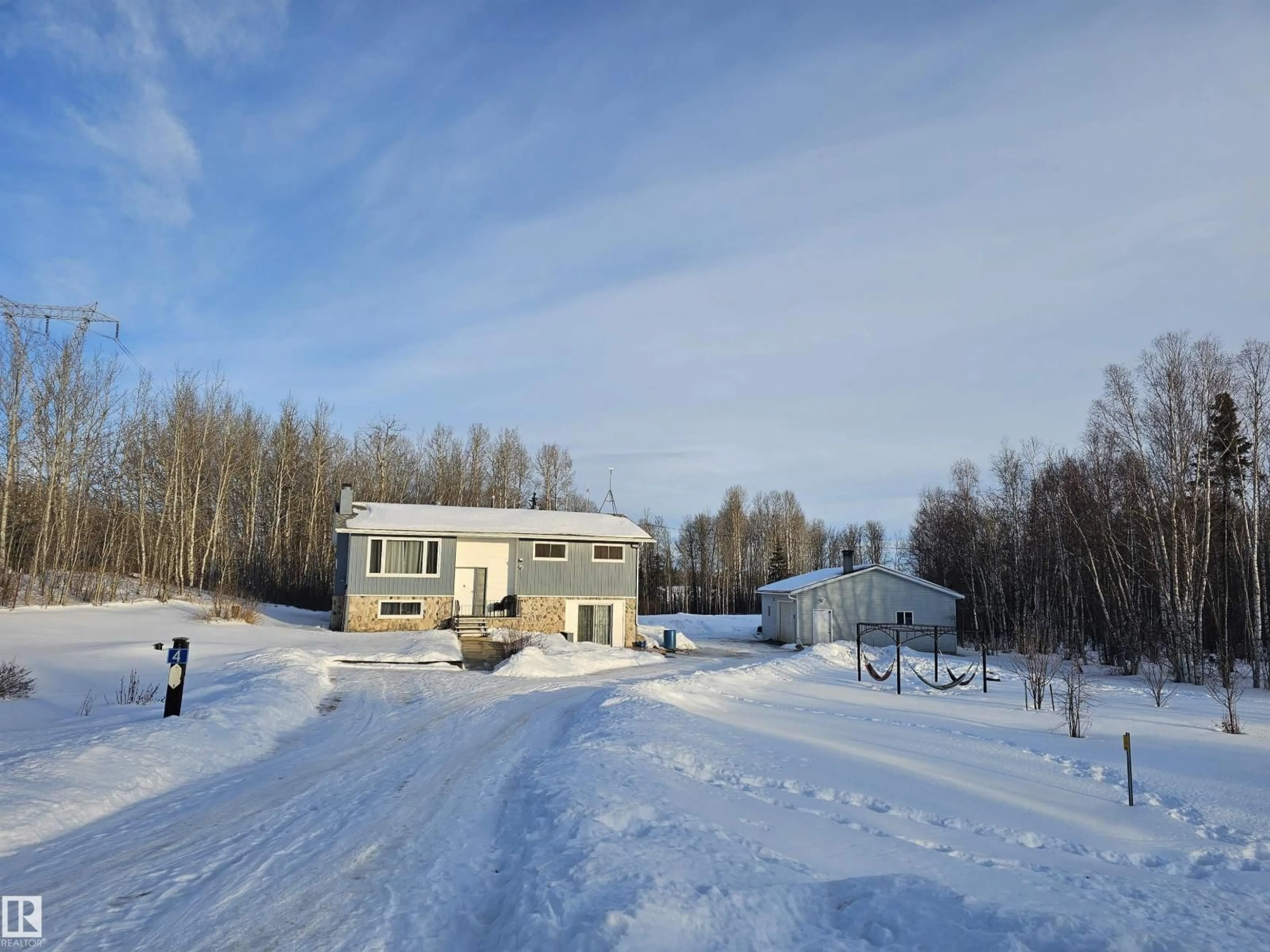 A pic from outside/outdoor area/front of a property/back of a property/a pic from drone, street for 4 - 54227 RGE ROAD 41, Rural Lac Ste. Anne County Alberta T0E0A1