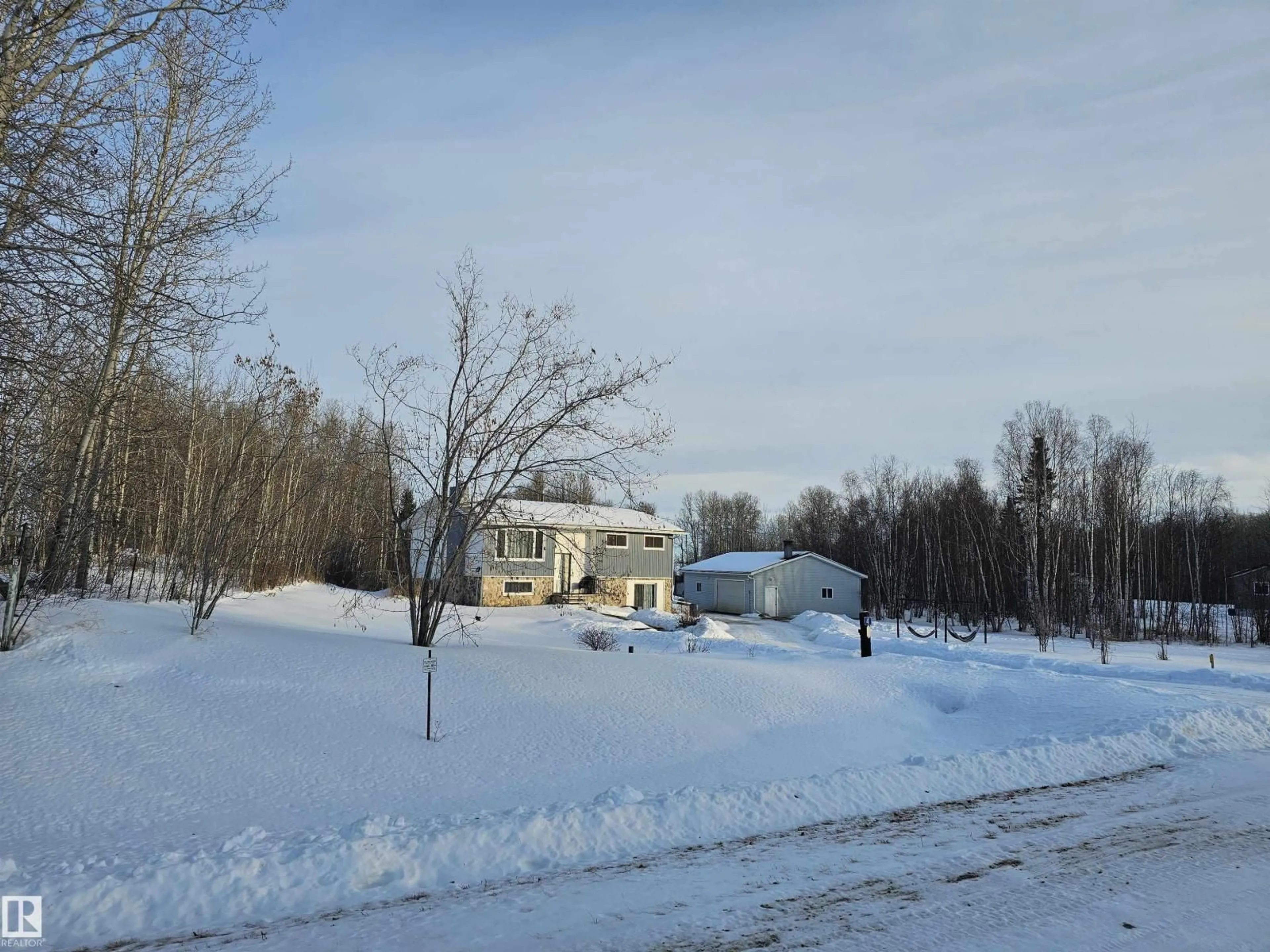 A pic from outside/outdoor area/front of a property/back of a property/a pic from drone, street for 4 - 54227 RGE ROAD 41, Rural Lac Ste. Anne County Alberta T0E0A1