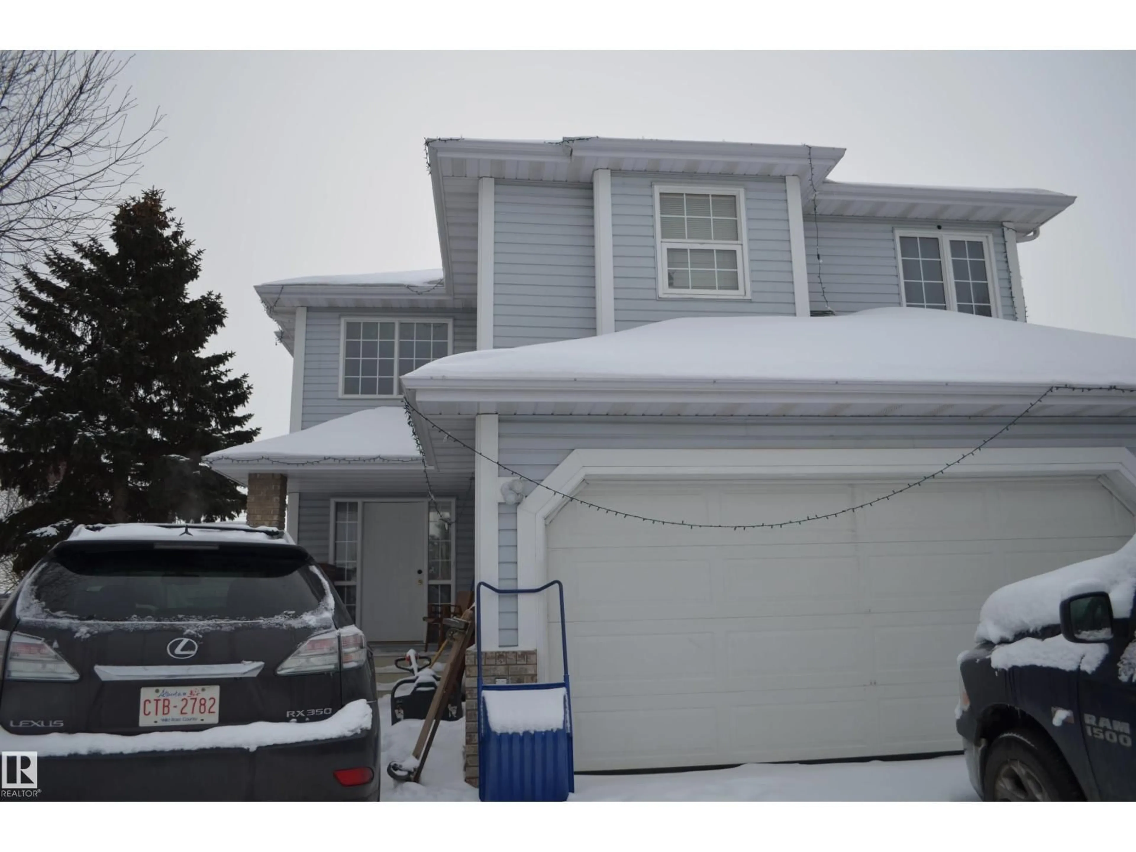 Home with vinyl exterior material, street for 11511 9 AV, Edmonton Alberta T6J6T9
