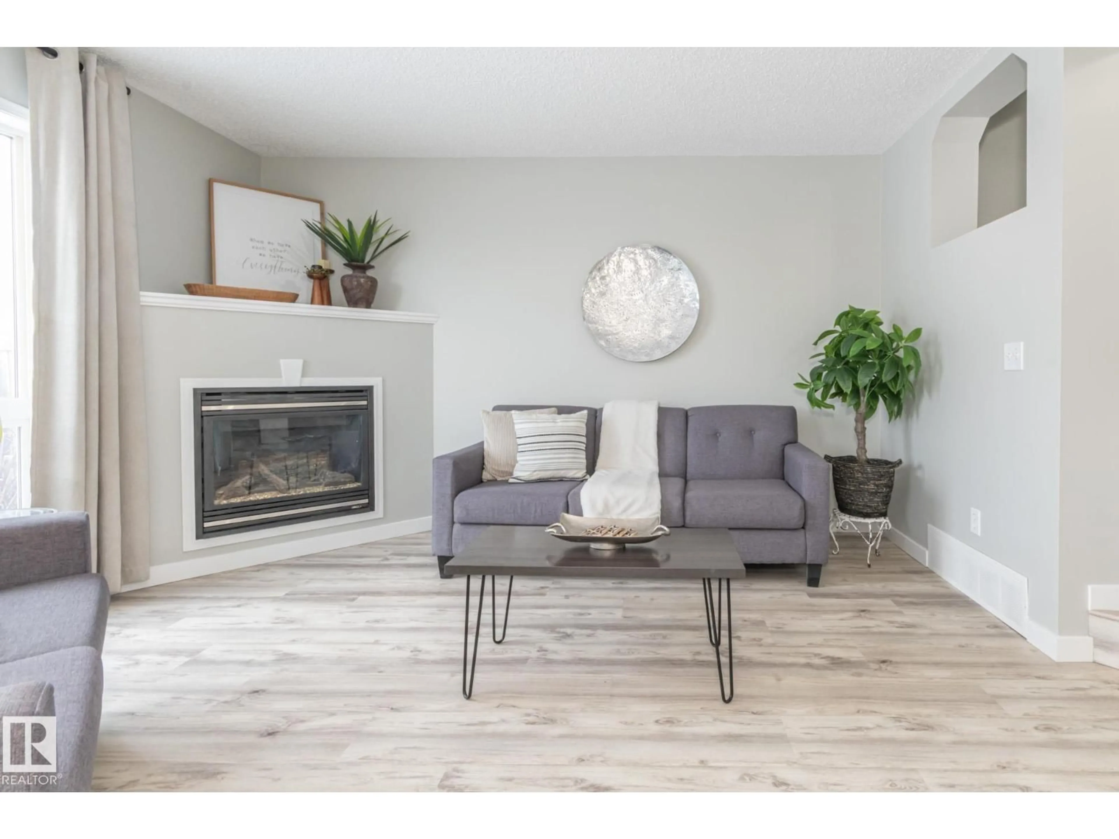 Living room with furniture, wood/laminate floor for 31 GALLOWAY WD, Fort Saskatchewan Alberta T8L0A3