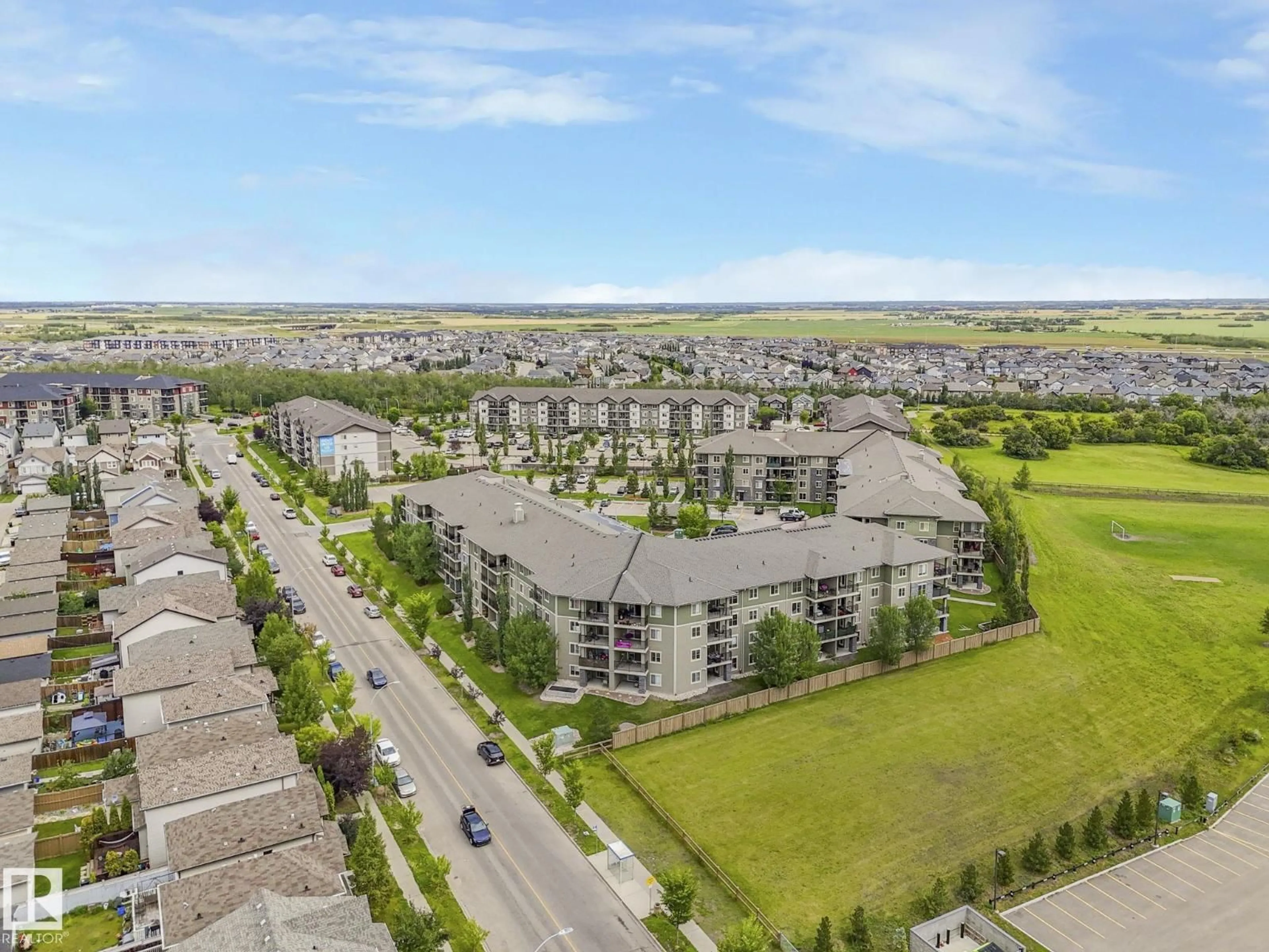 A pic from outside/outdoor area/front of a property/back of a property/a pic from drone, mountain view for #404 - 270 MCCONACHIE DR, Edmonton Alberta T5Y3N4