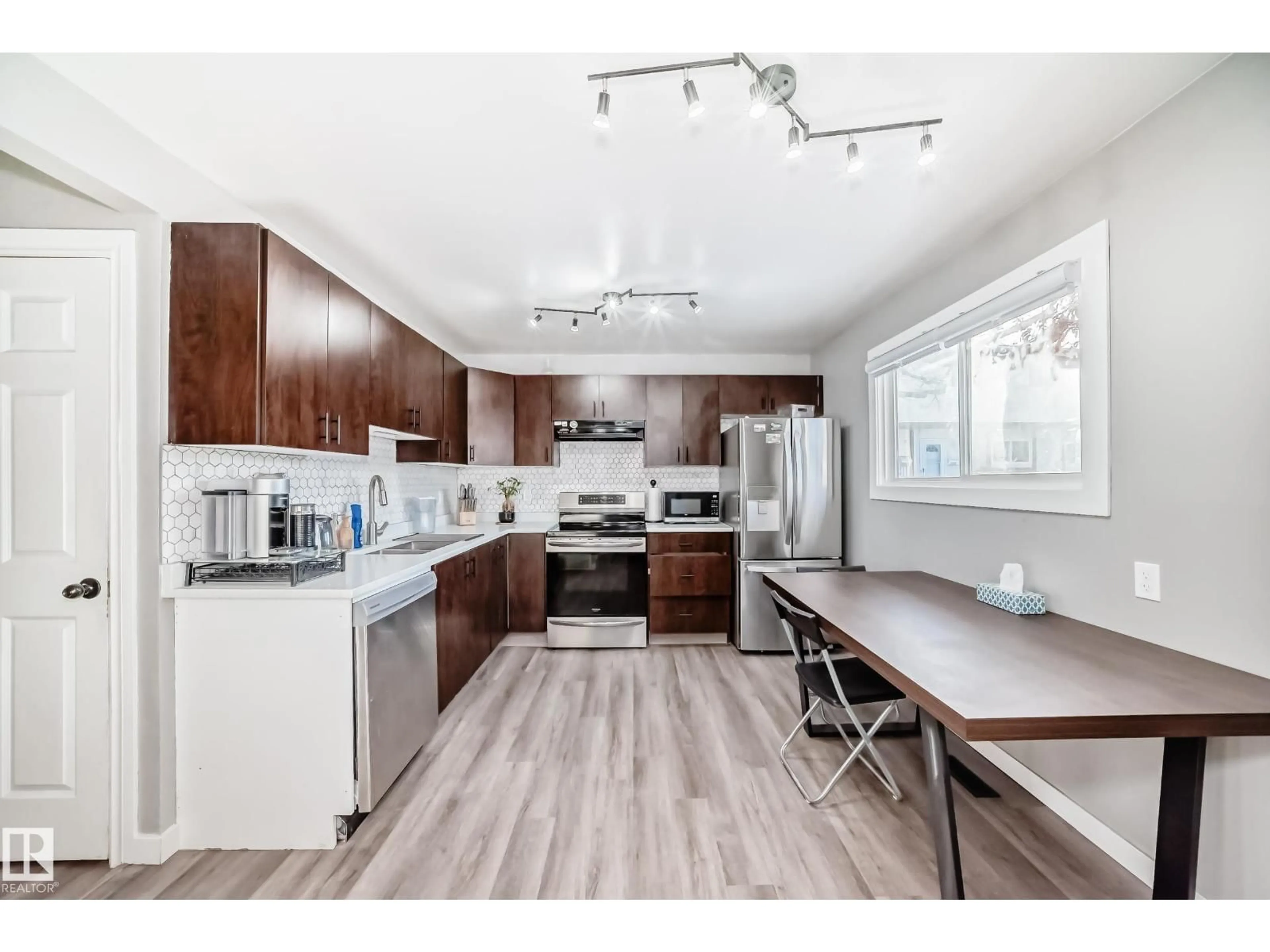 Open concept kitchen, wood/laminate floor for 1272 LAKEWOOD RD, Edmonton Alberta T6K3P2