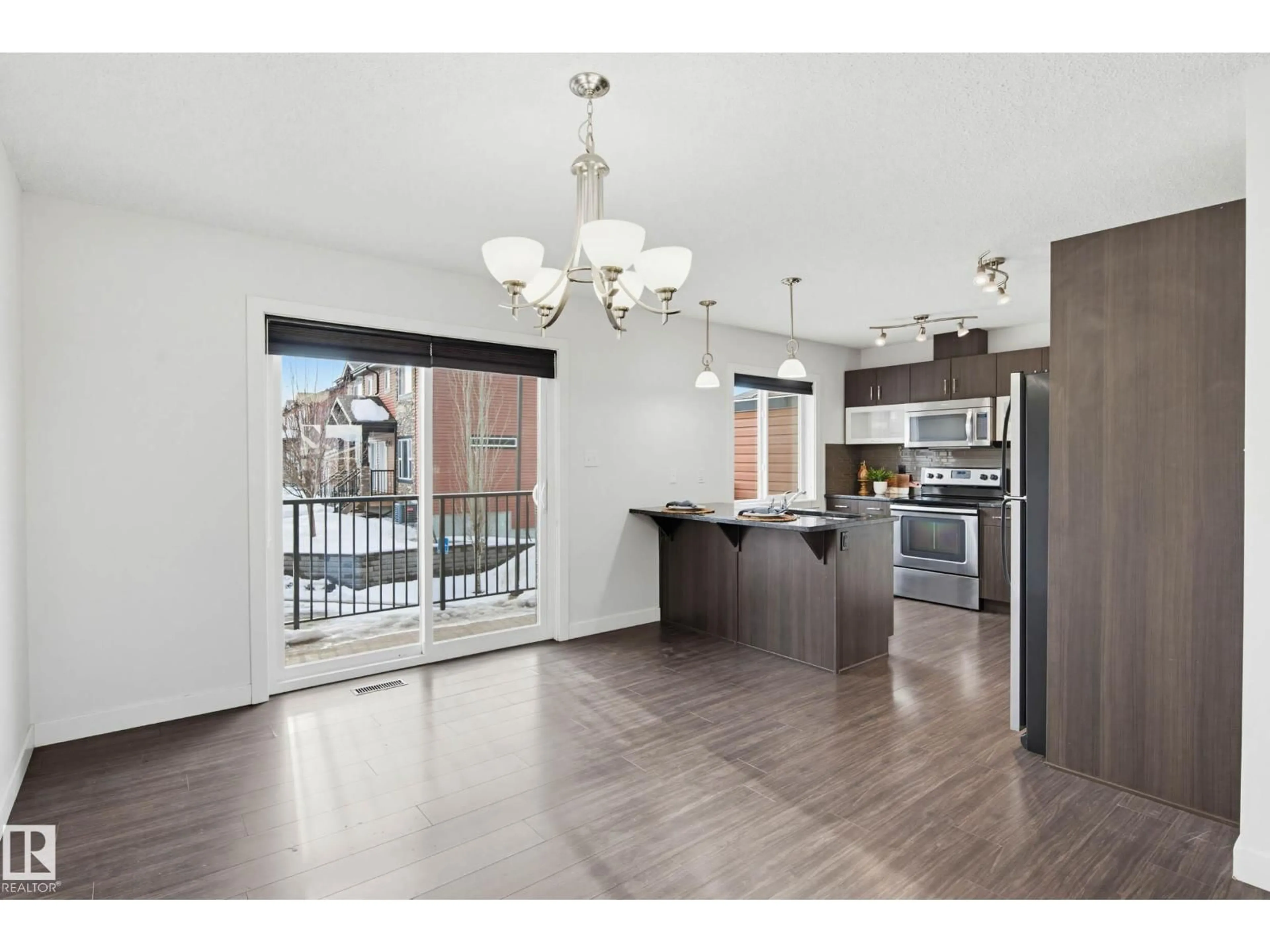 Open concept kitchen, wood/laminate floor for 68 301 PALISADES WY, Sherwood Park Alberta T8H0T4