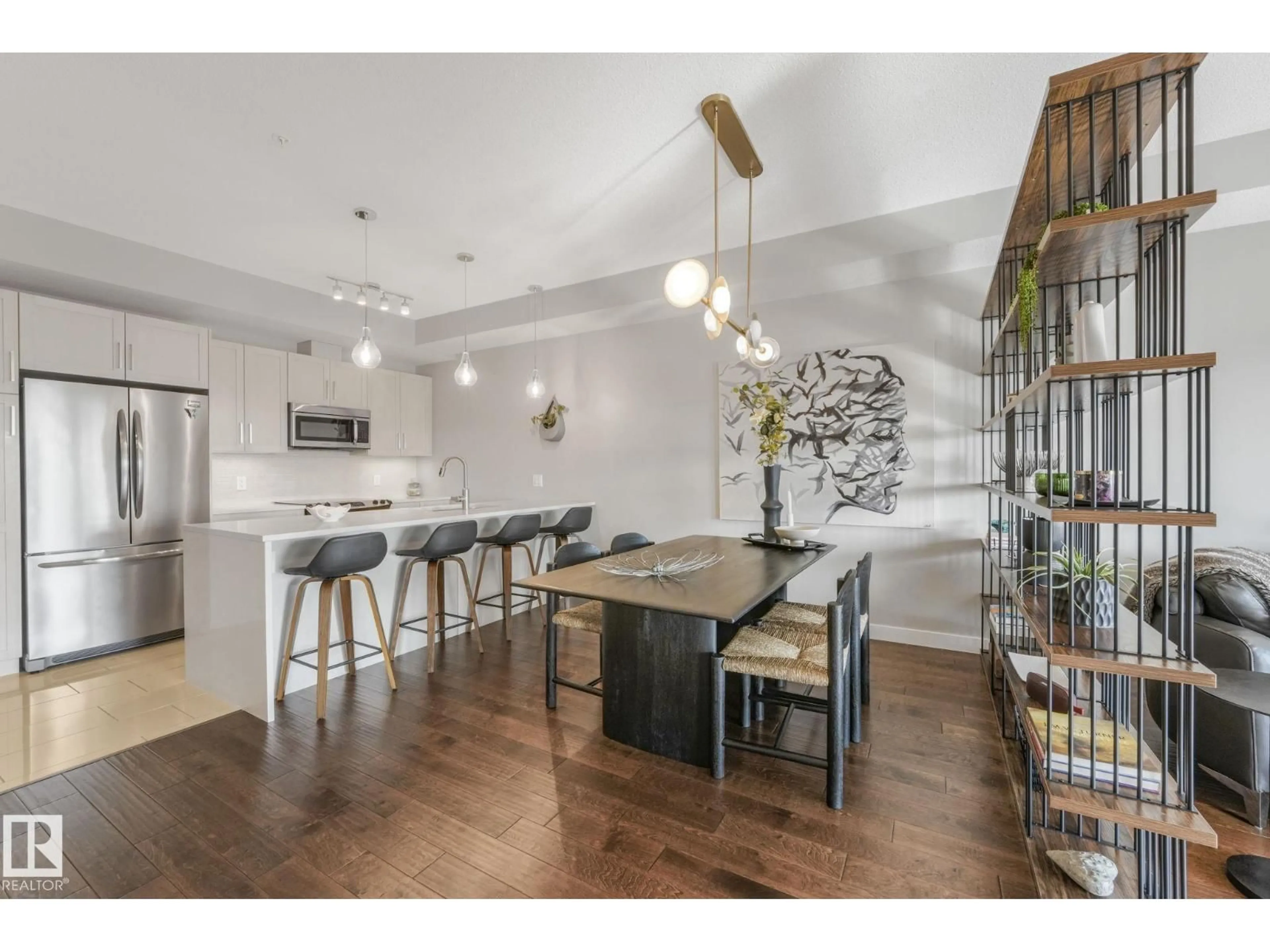 Open concept kitchen, wood/laminate floor for #409 - 625 LEGER WY, Edmonton Alberta T6R0W4