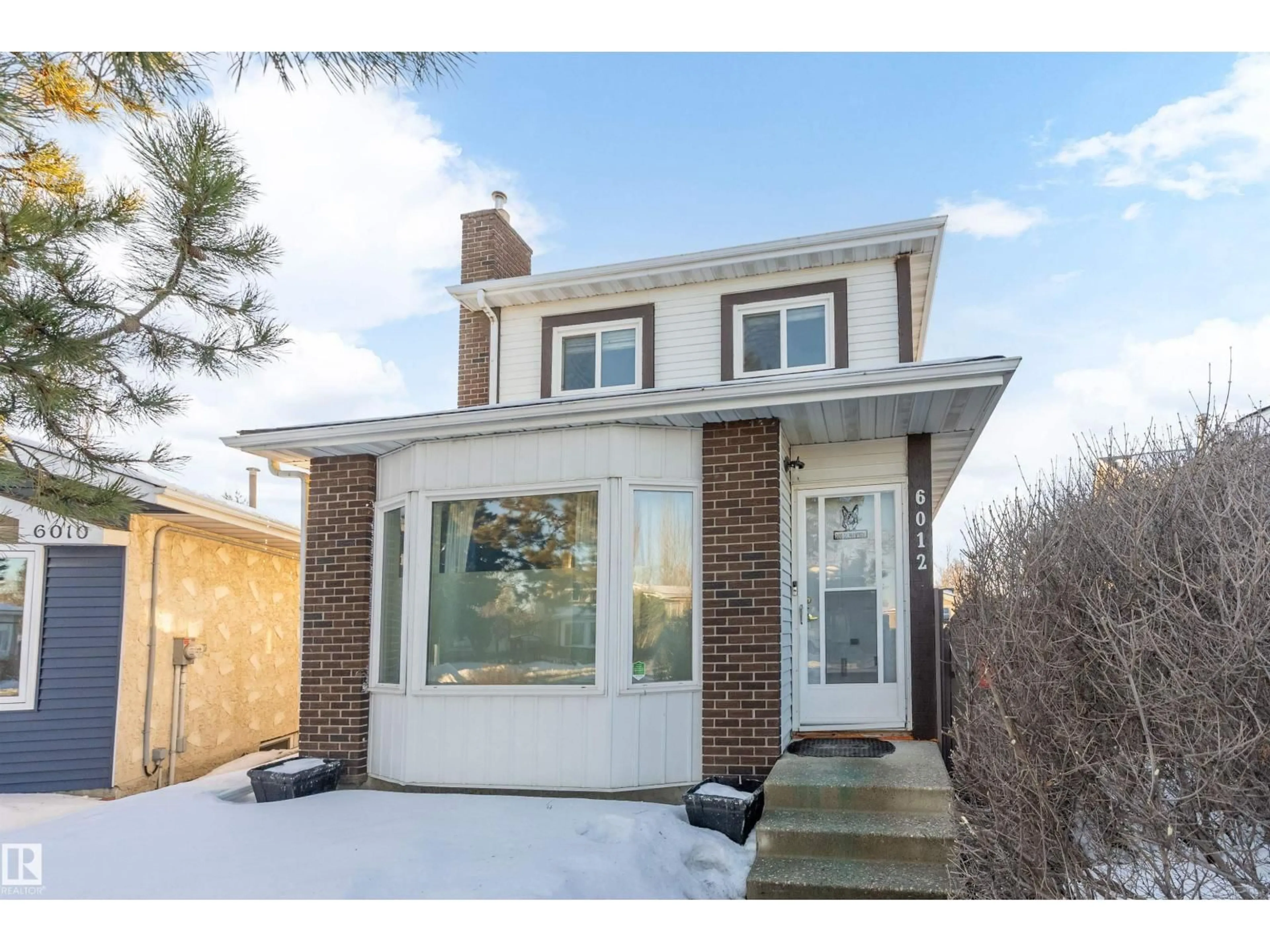 Home with brick exterior material, street for 6012 187 ST, Edmonton Alberta T6M2B4