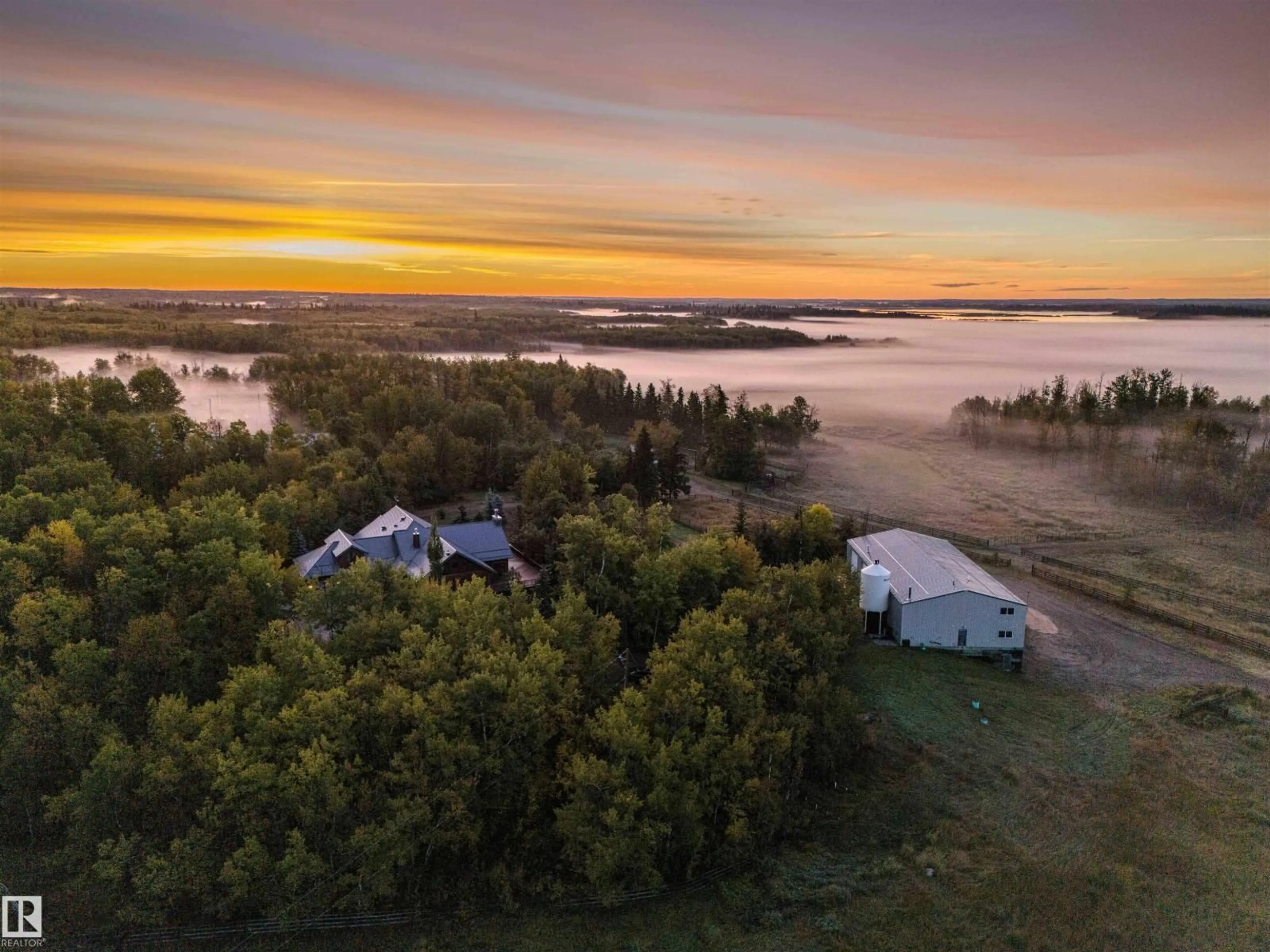 A pic from outside/outdoor area/front of a property/back of a property/a pic from drone, water/lake/river/ocean view for 52117 RR 213, Rural Strathcona County Alberta T8G1B5