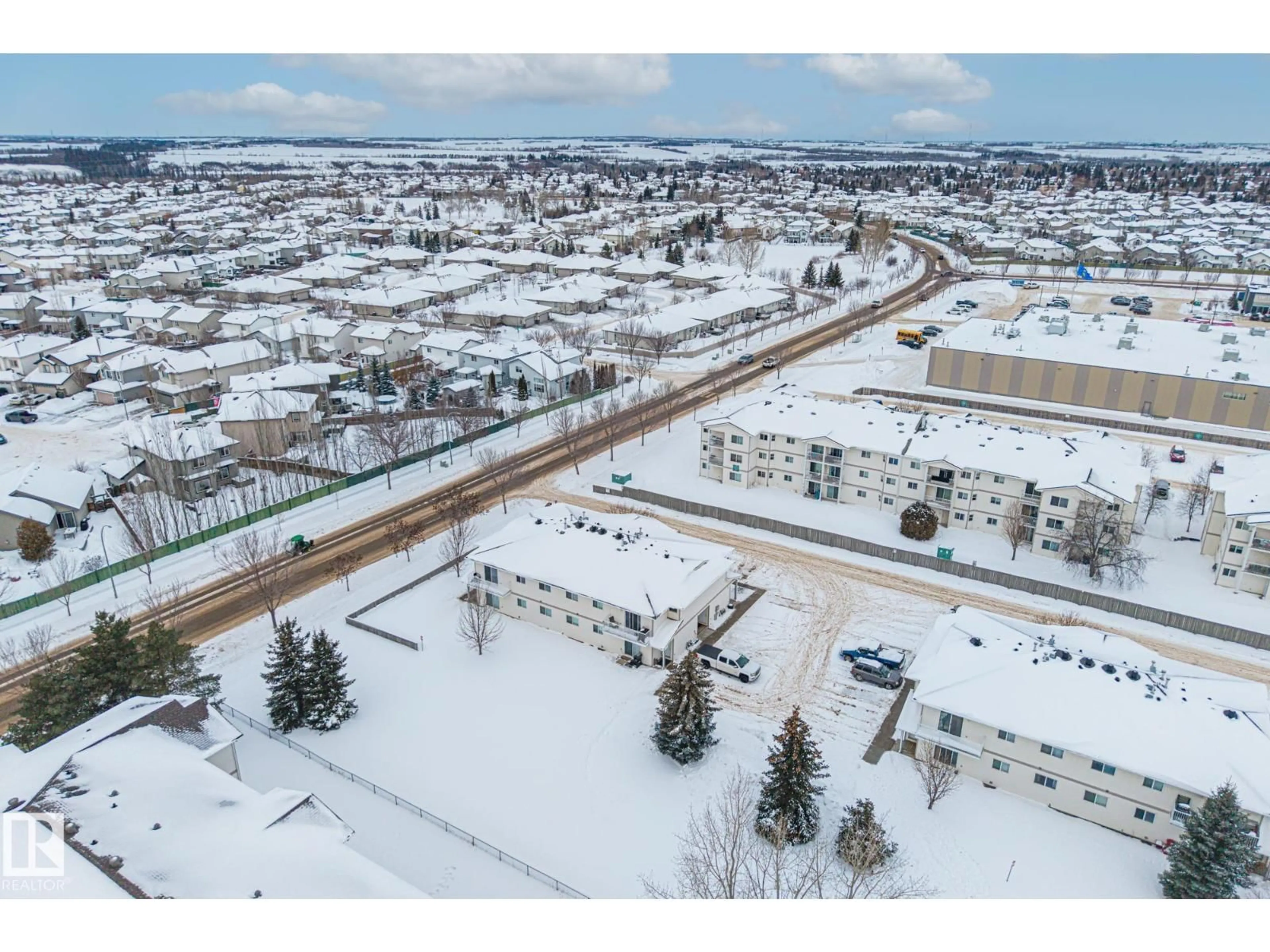 A pic from outside/outdoor area/front of a property/back of a property/a pic from drone, unknown for #103A - 110 WESTPARK, Fort Saskatchewan Alberta T8L4M2