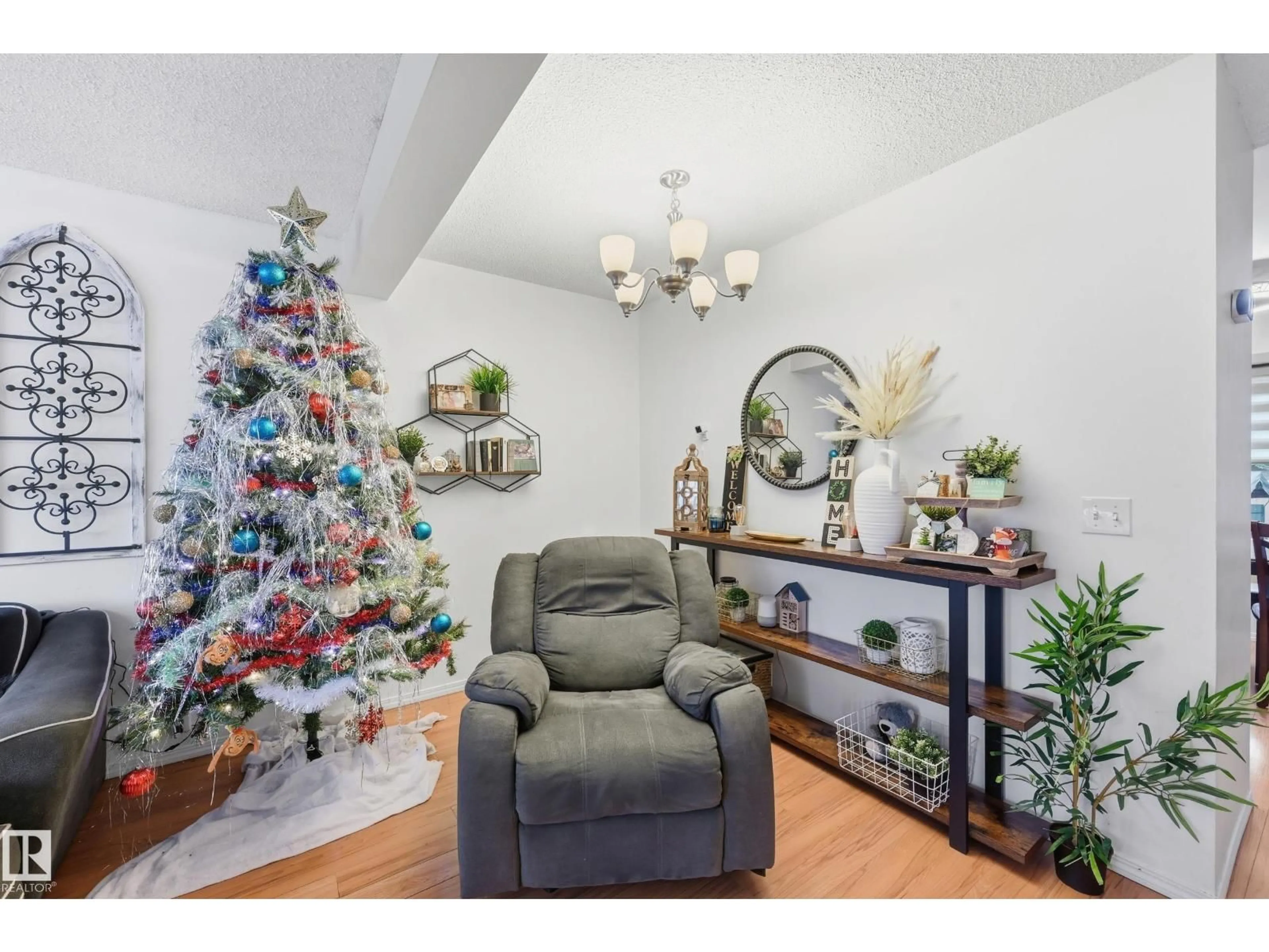 Living room with furniture, wood/laminate floor for 18423 95A AV, Edmonton Alberta T5T3V7
