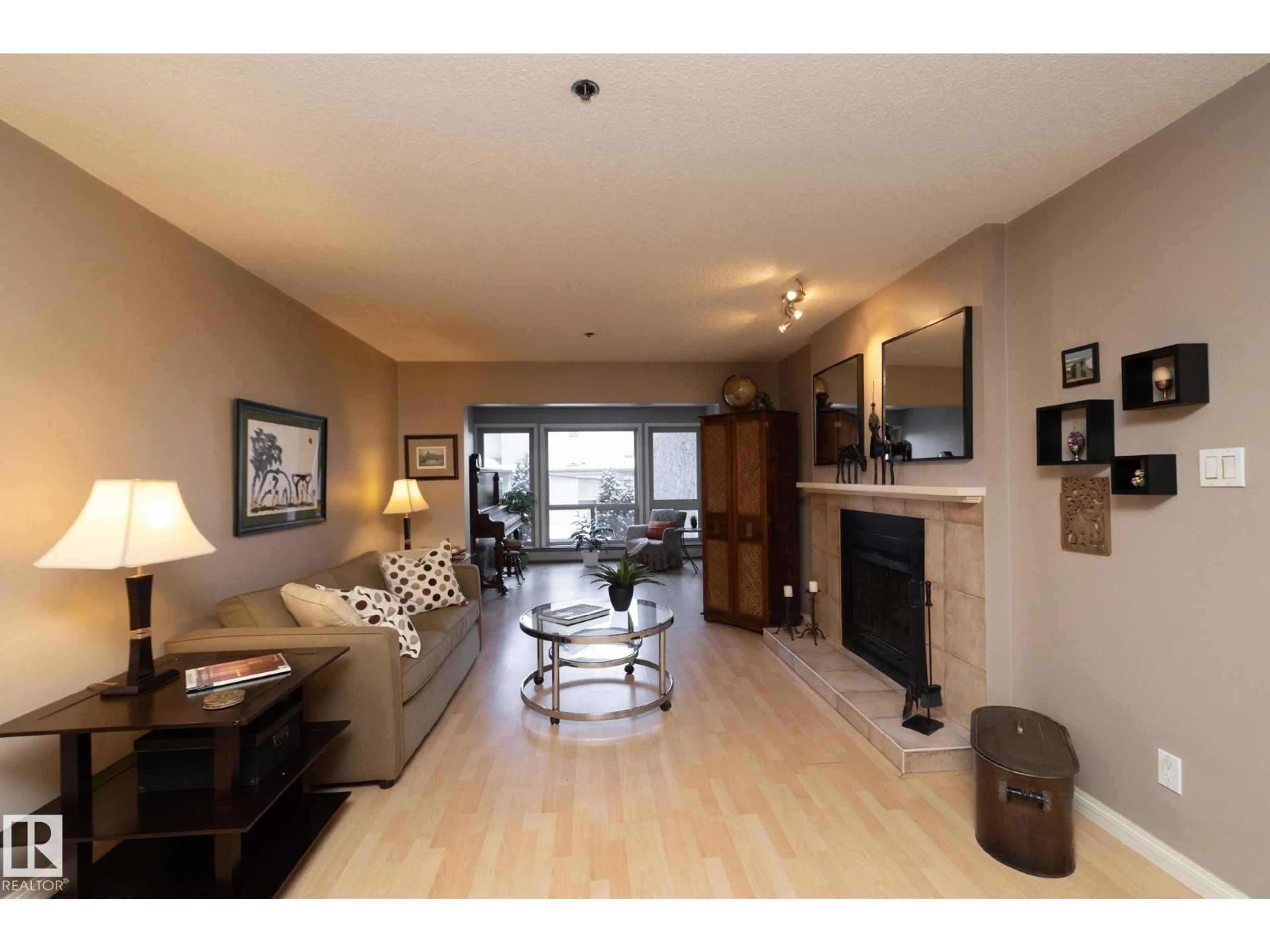 Living room with furniture, wood/laminate floor for #203 - 10171 119 ST, Edmonton Alberta T5X1Z1
