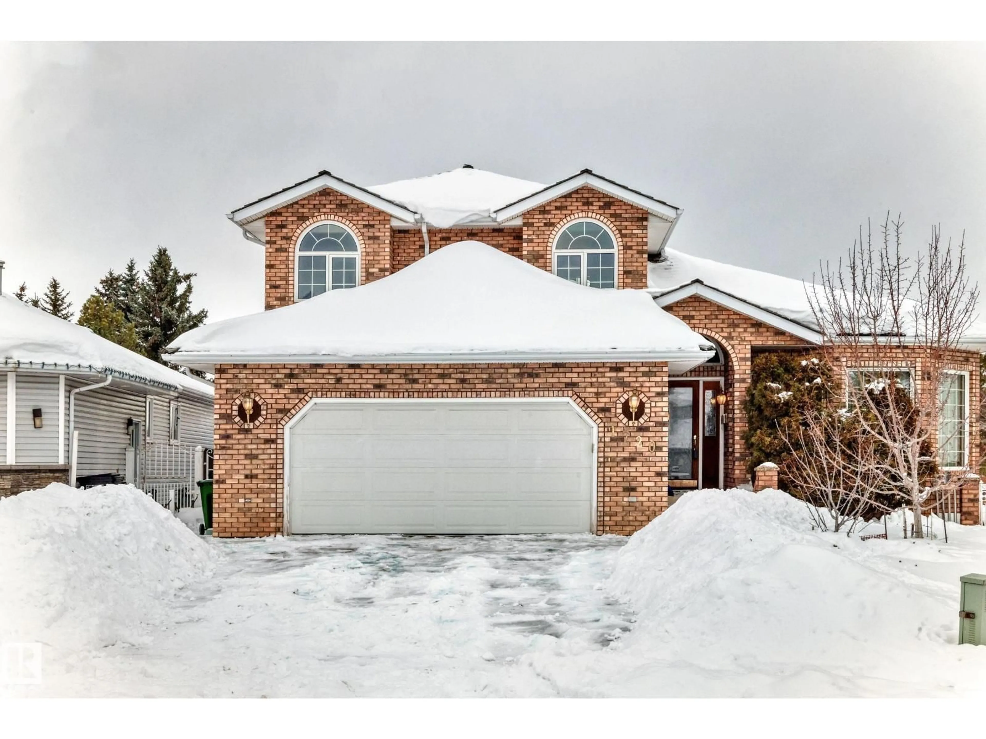 Home with brick exterior material, street for 1720 BEARSPAW DR, Edmonton Alberta T6J5E3