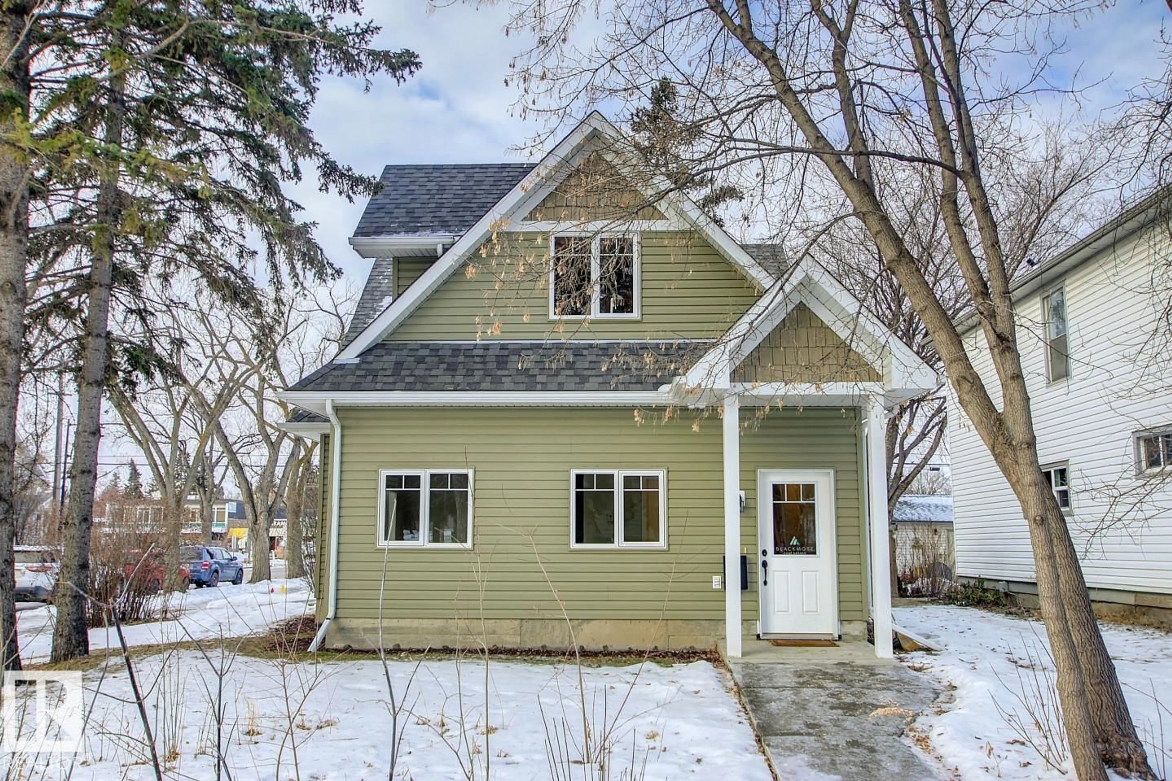 Home with vinyl exterior material, street for 12304 108 AV, Edmonton Alberta T5M2B4