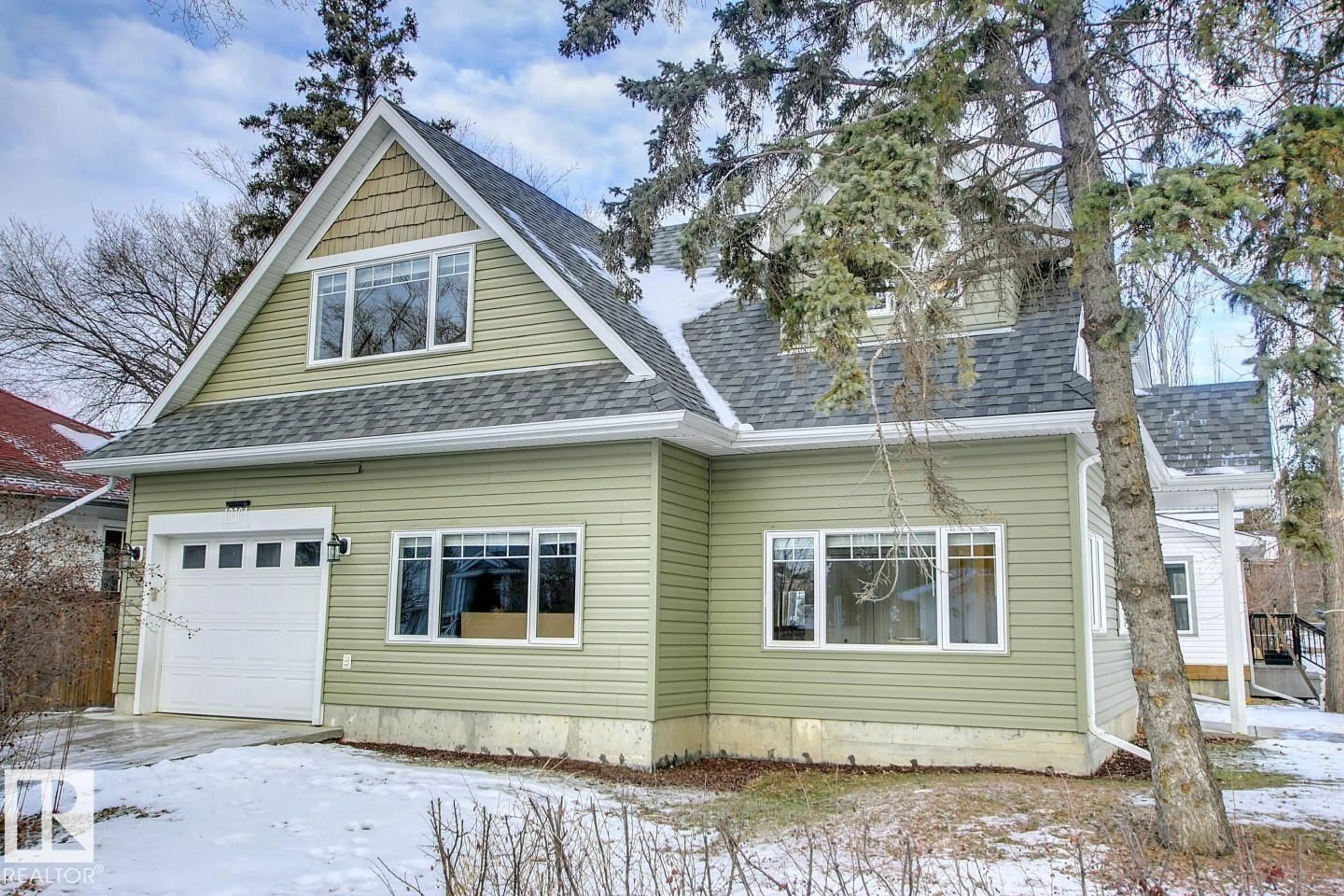 Home with vinyl exterior material, street for 12304 108 AV, Edmonton Alberta T5M2B4