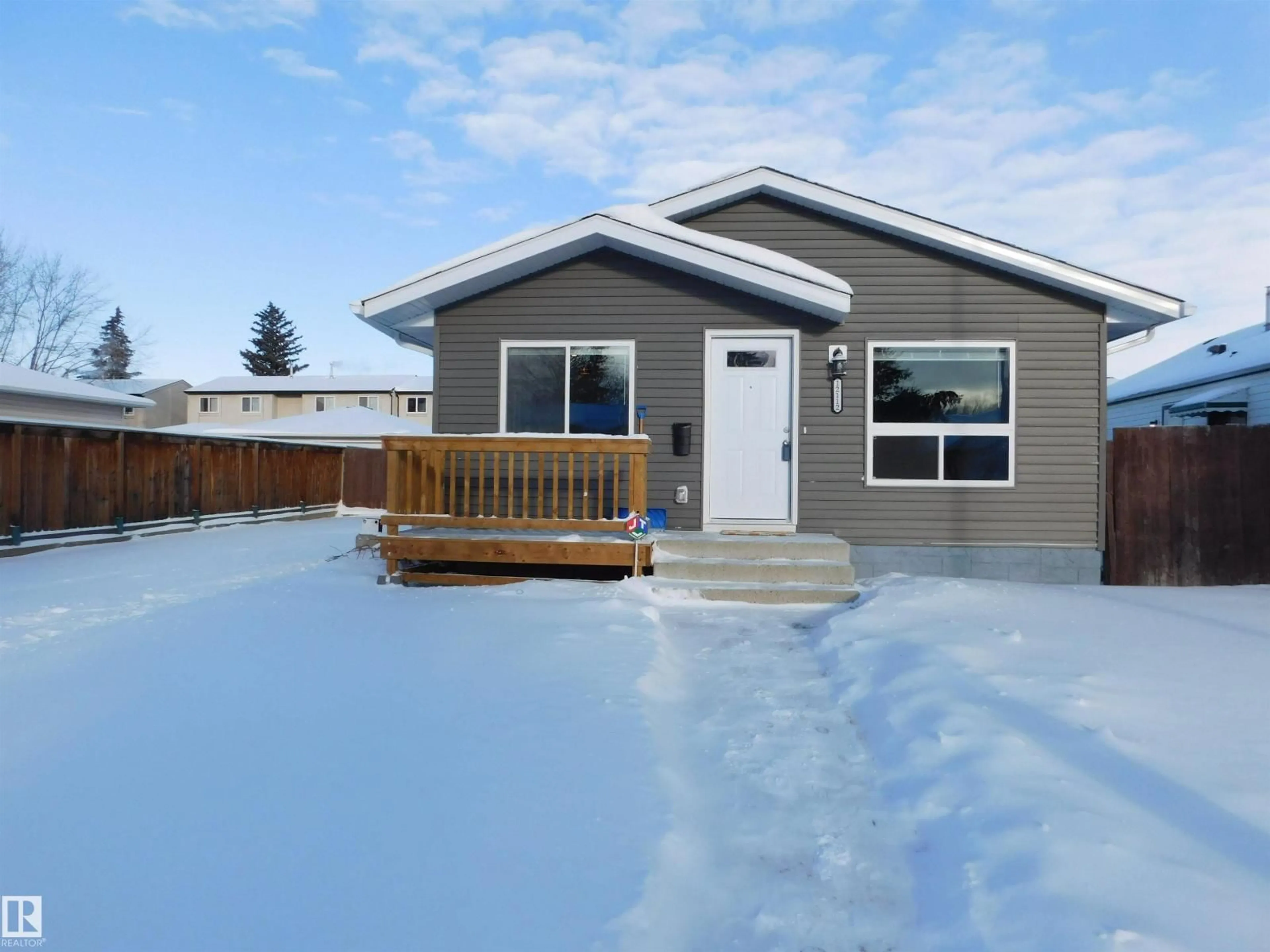 Home with vinyl exterior material, street for 12112 150 AV, Edmonton Alberta T5X2C3