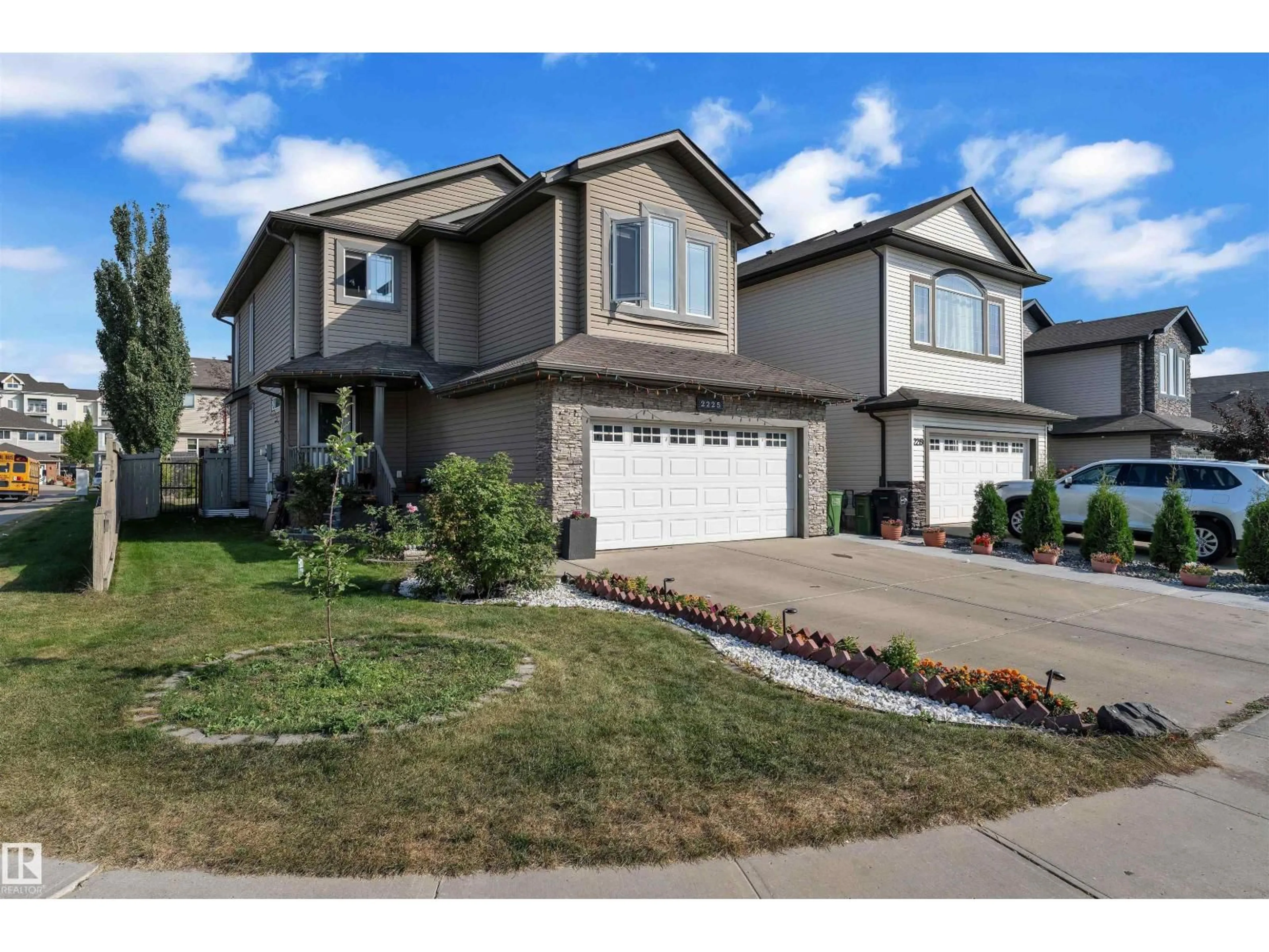 Home with vinyl exterior material, street for NW - 2225 32B ST, Edmonton Alberta T6T0K6