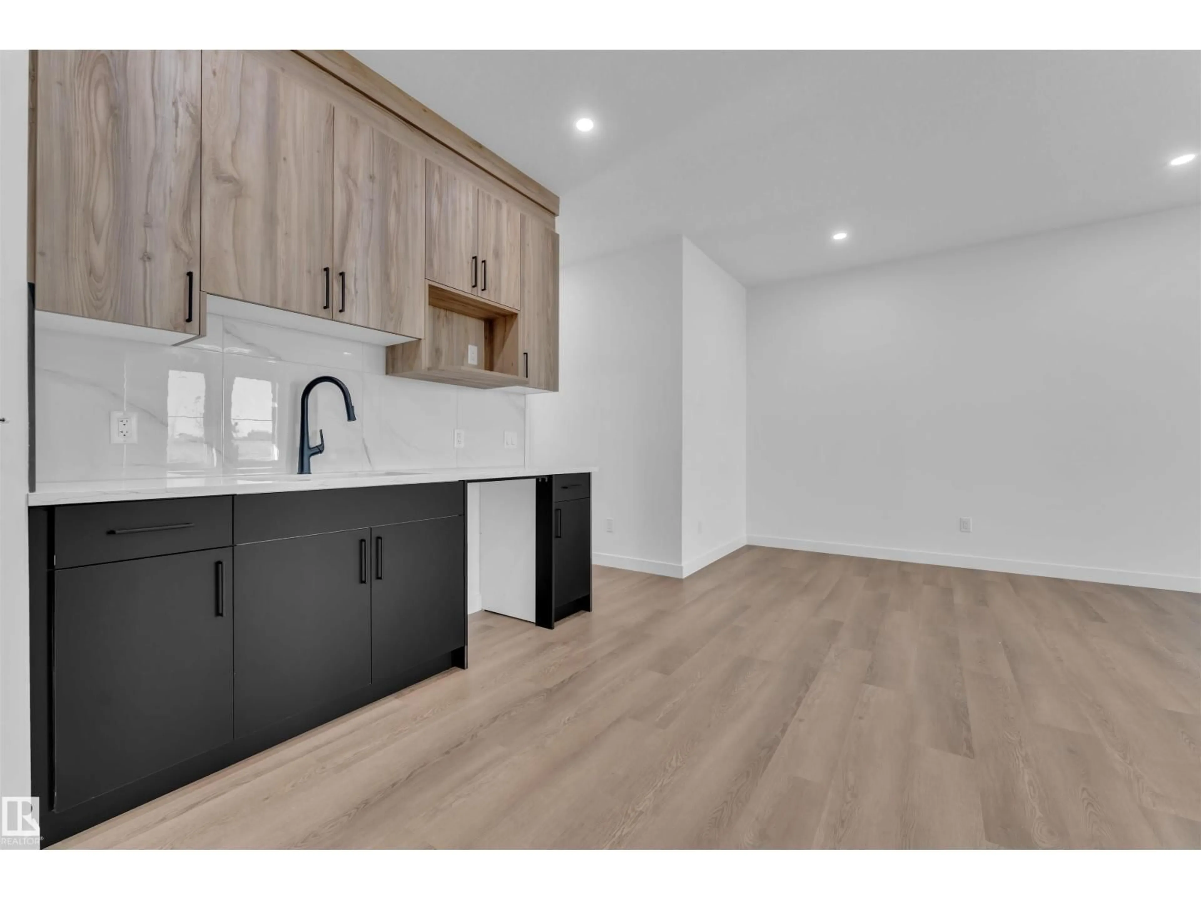 Open concept kitchen, wood/laminate floor for 3618 39 AV, Beaumont Alberta T4X3H2