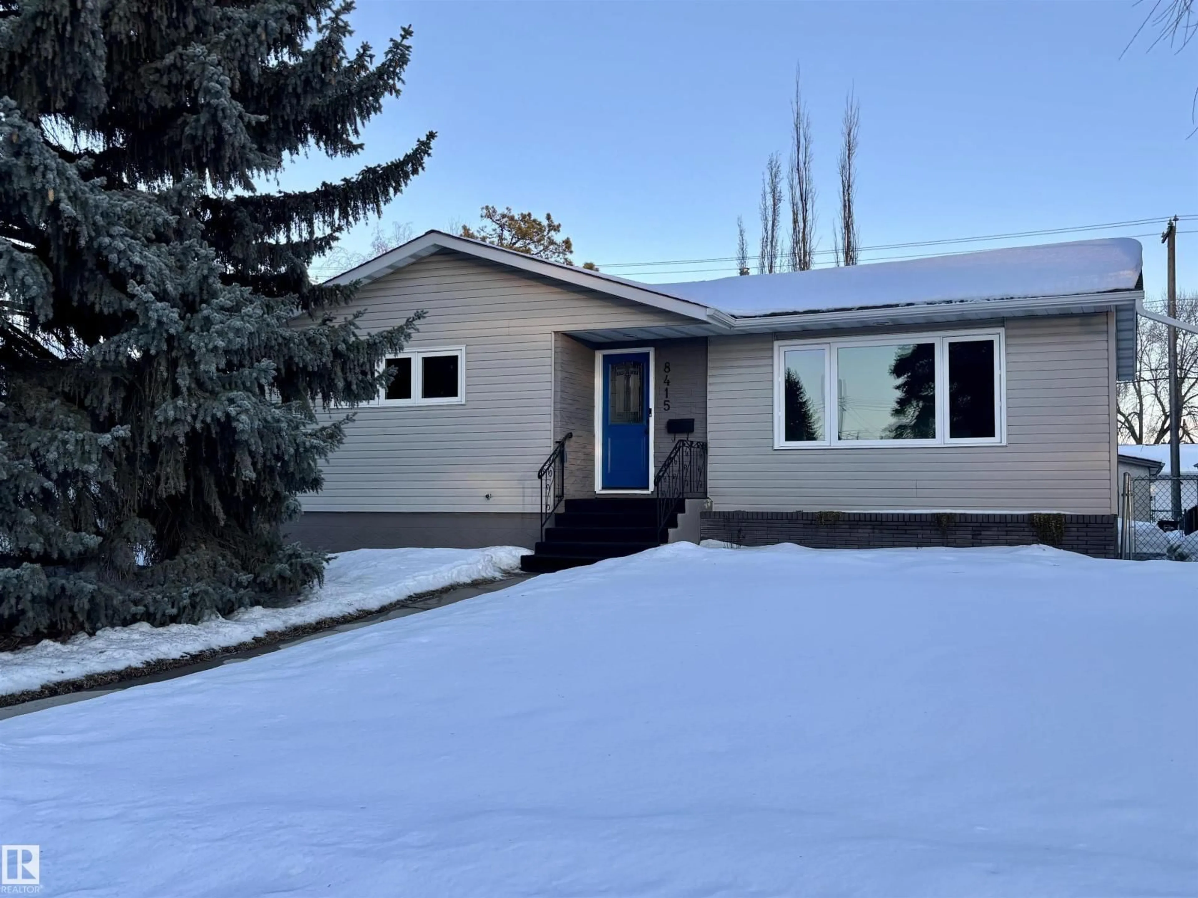 Home with vinyl exterior material, street for NW - 8415 72 ST, Edmonton Alberta T6B1Y3