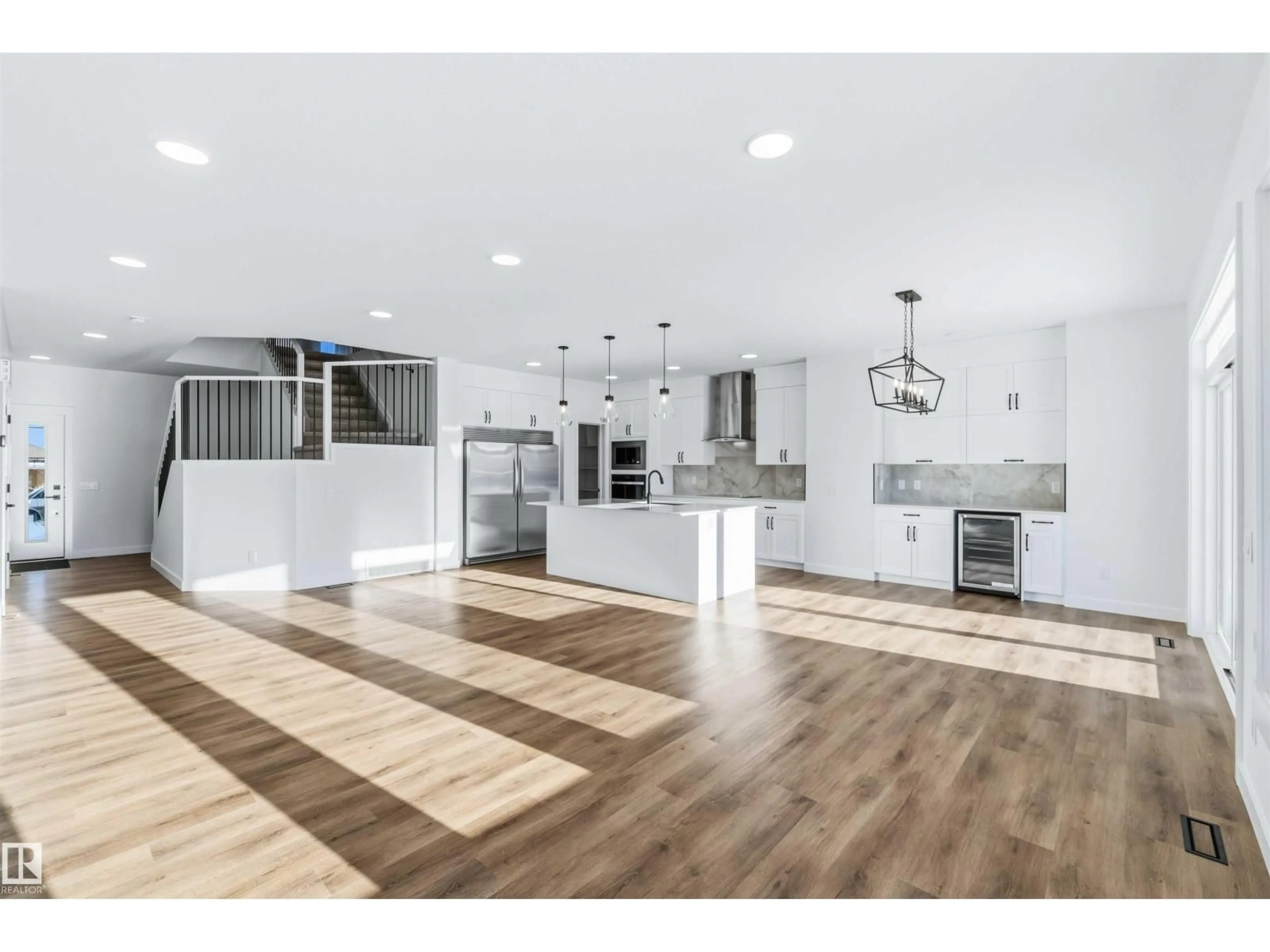 Open concept kitchen, wood/laminate floor for 2211 4 AV, Edmonton Alberta T6X3L4