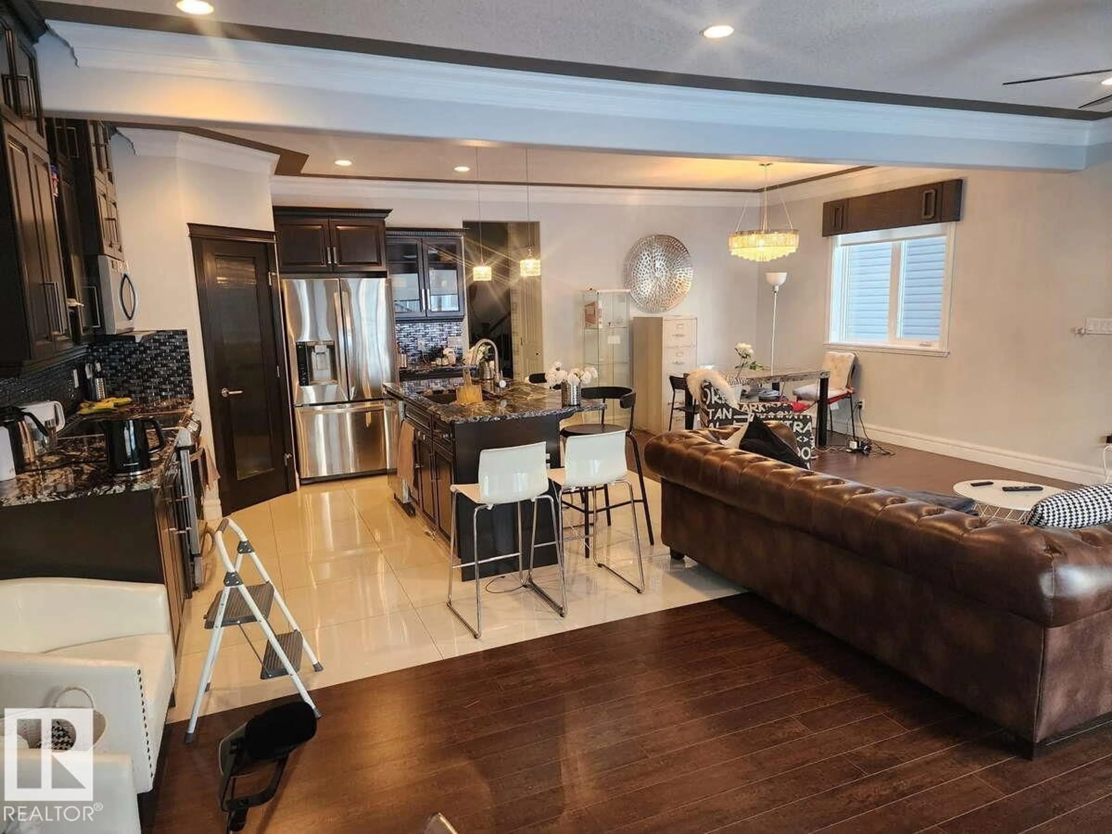 Open concept kitchen, wood/laminate floor for NW - 16756 60 ST, Edmonton Alberta T5Y0W5