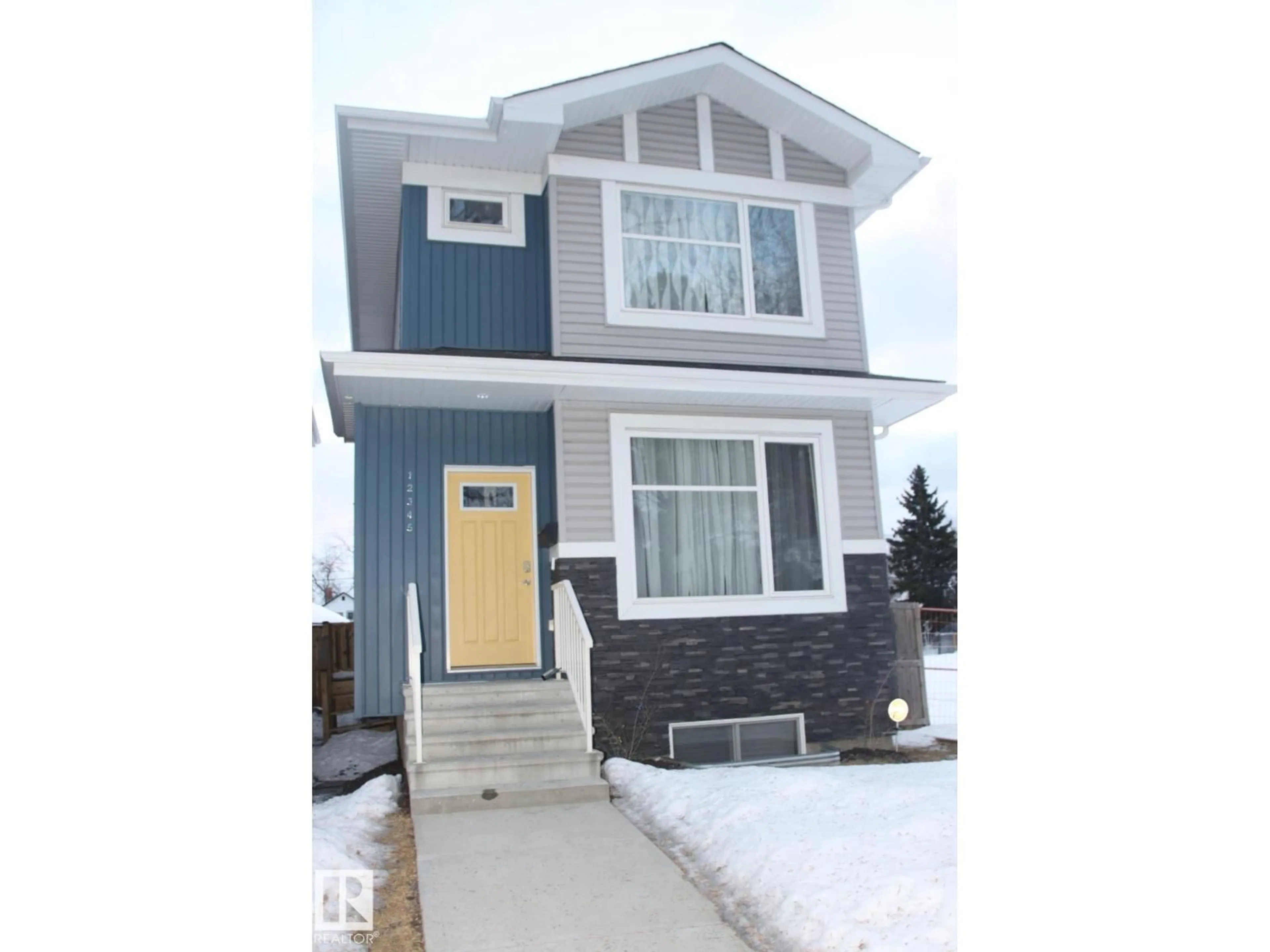 Home with vinyl exterior material, street for NW - 12345 85 ST, Edmonton Alberta T5B3H1