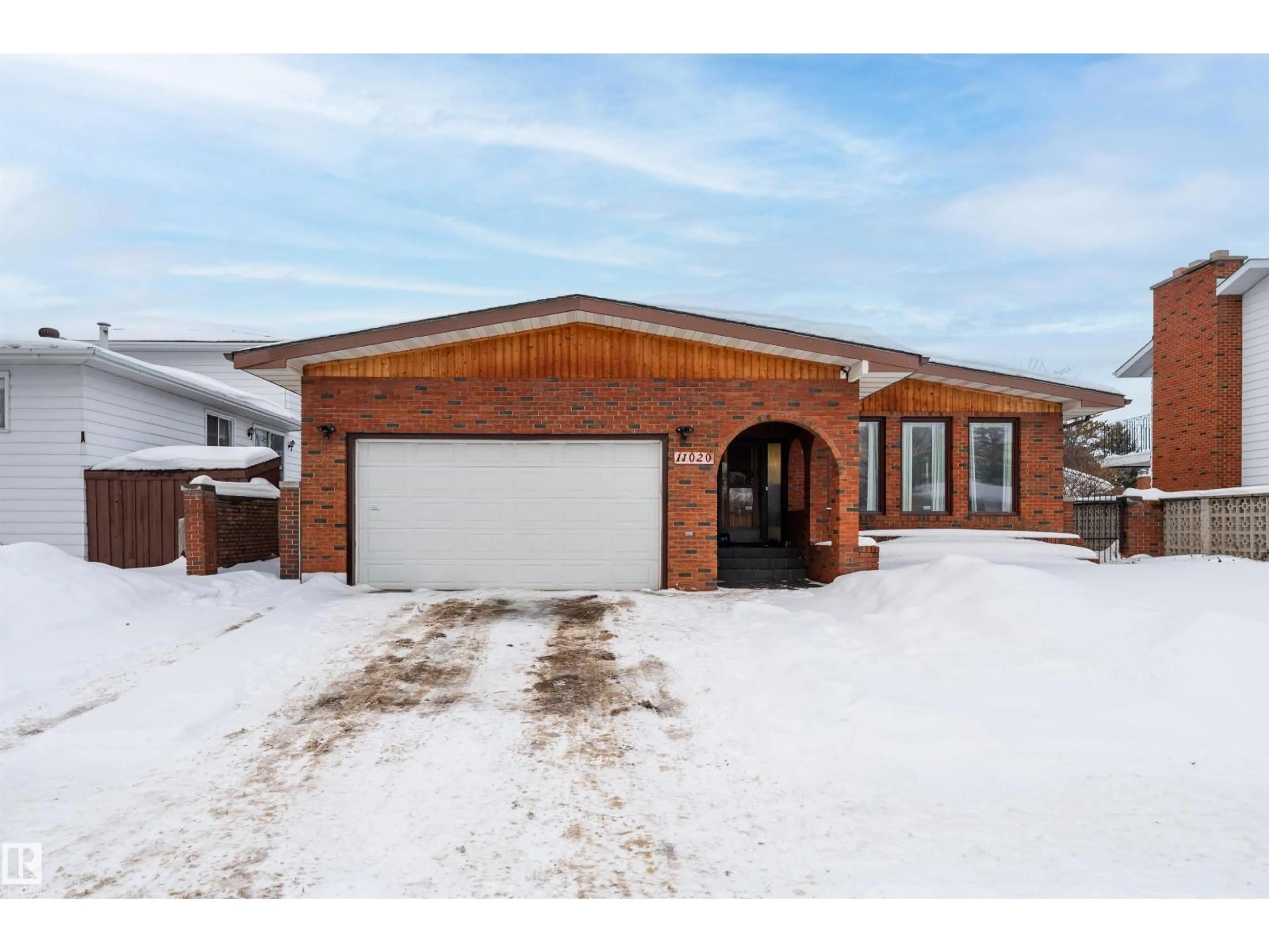 Home with brick exterior material, street for NW - 11020 171 AV, Edmonton Alberta T5X3J6