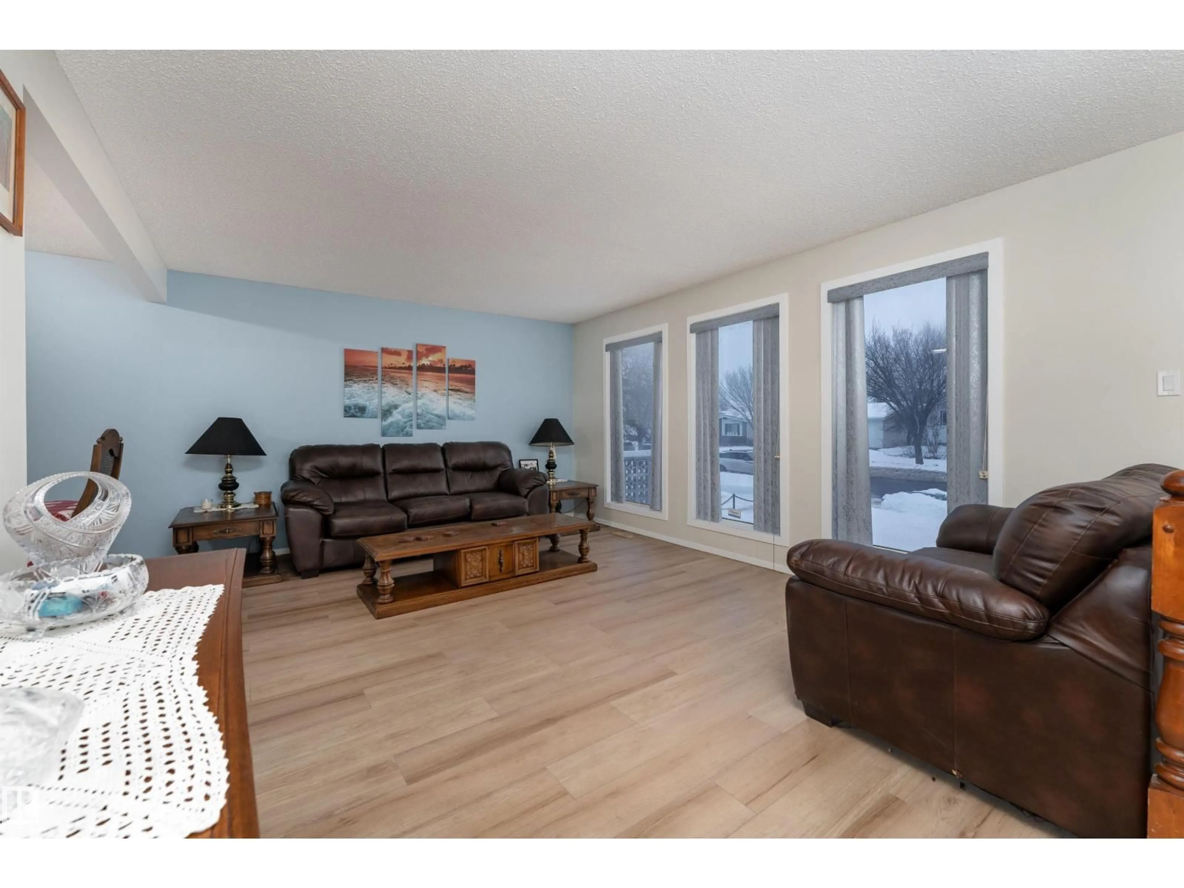 Living room with furniture, wood/laminate floor for NW - 11020 171 AV, Edmonton Alberta T5X3J6