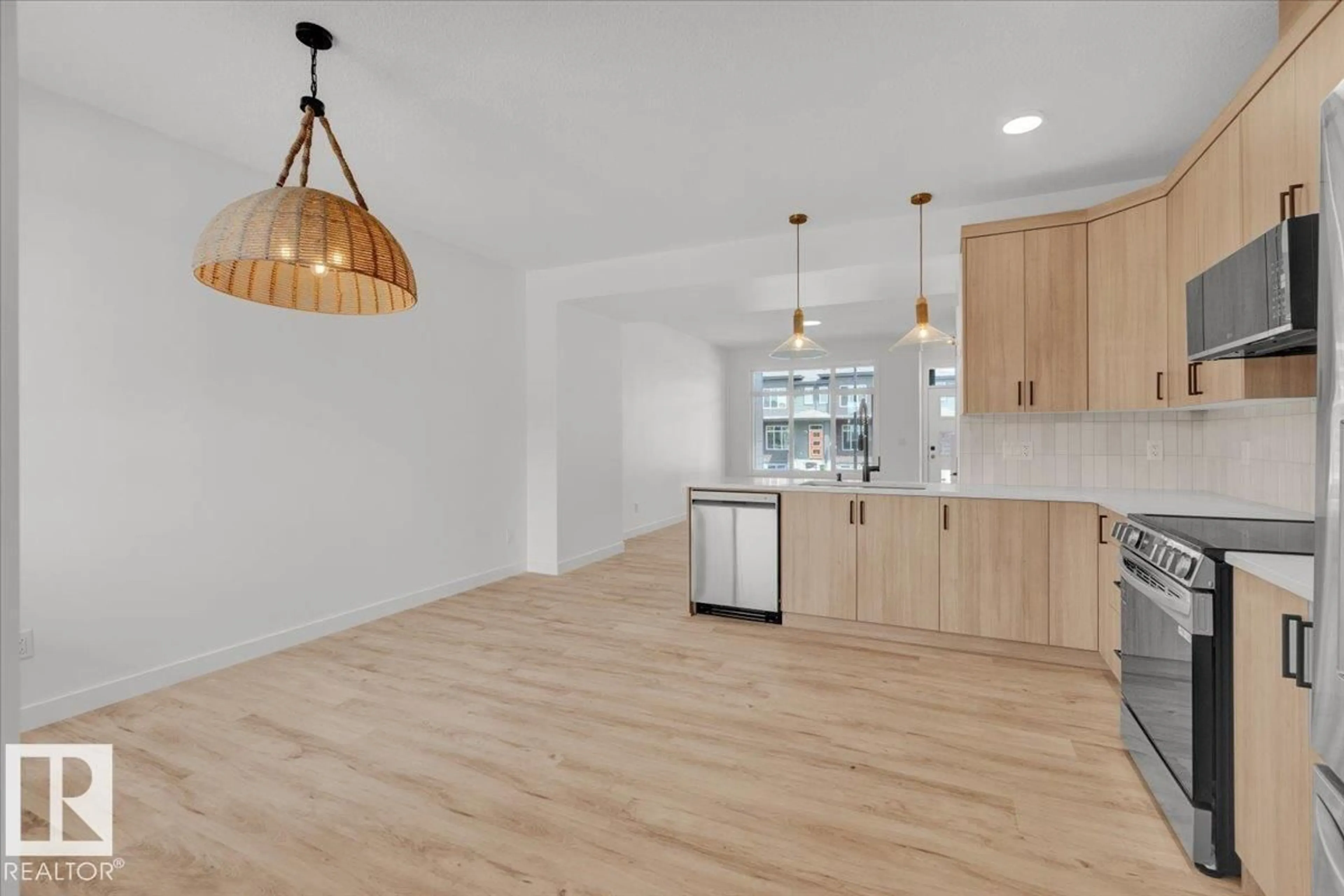 Open concept kitchen, wood/laminate floor for 1321 KESWICK DR, Edmonton Alberta T6W4V8