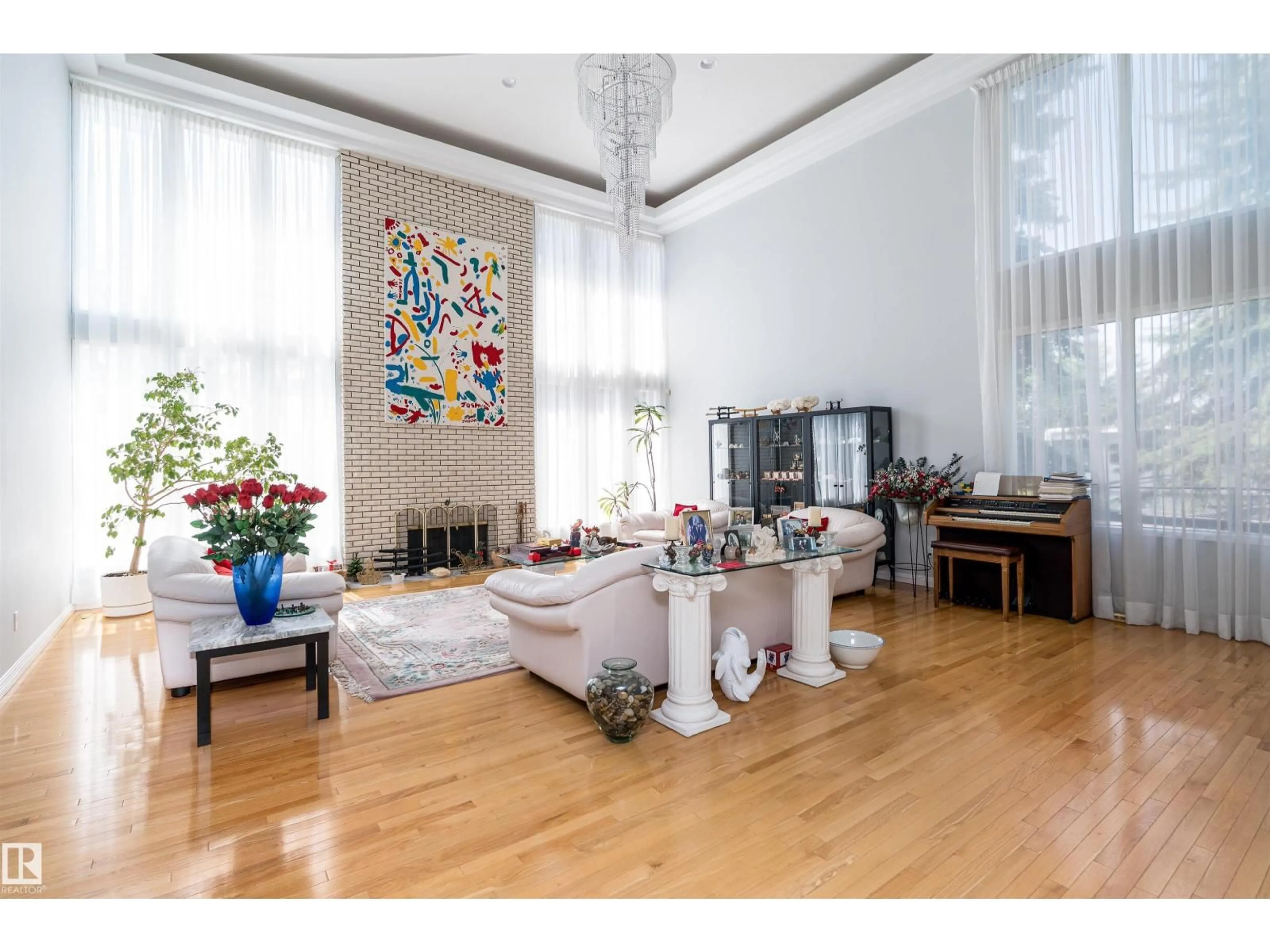 Living room with furniture, wood/laminate floor for SW - 10812 5 AV, Edmonton Alberta T6W1A2