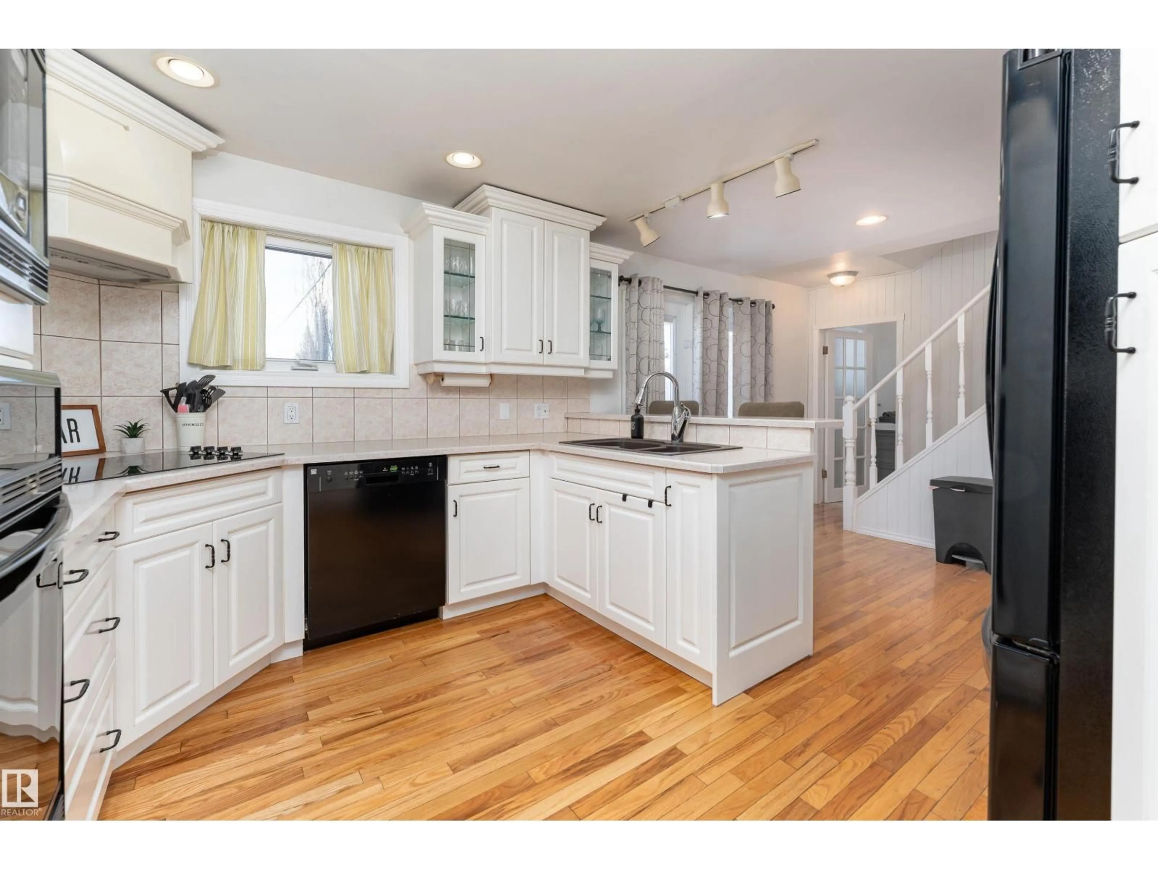 Open concept kitchen, wood/laminate floor for 4712 50 AV, Beaumont Alberta T4X1H5