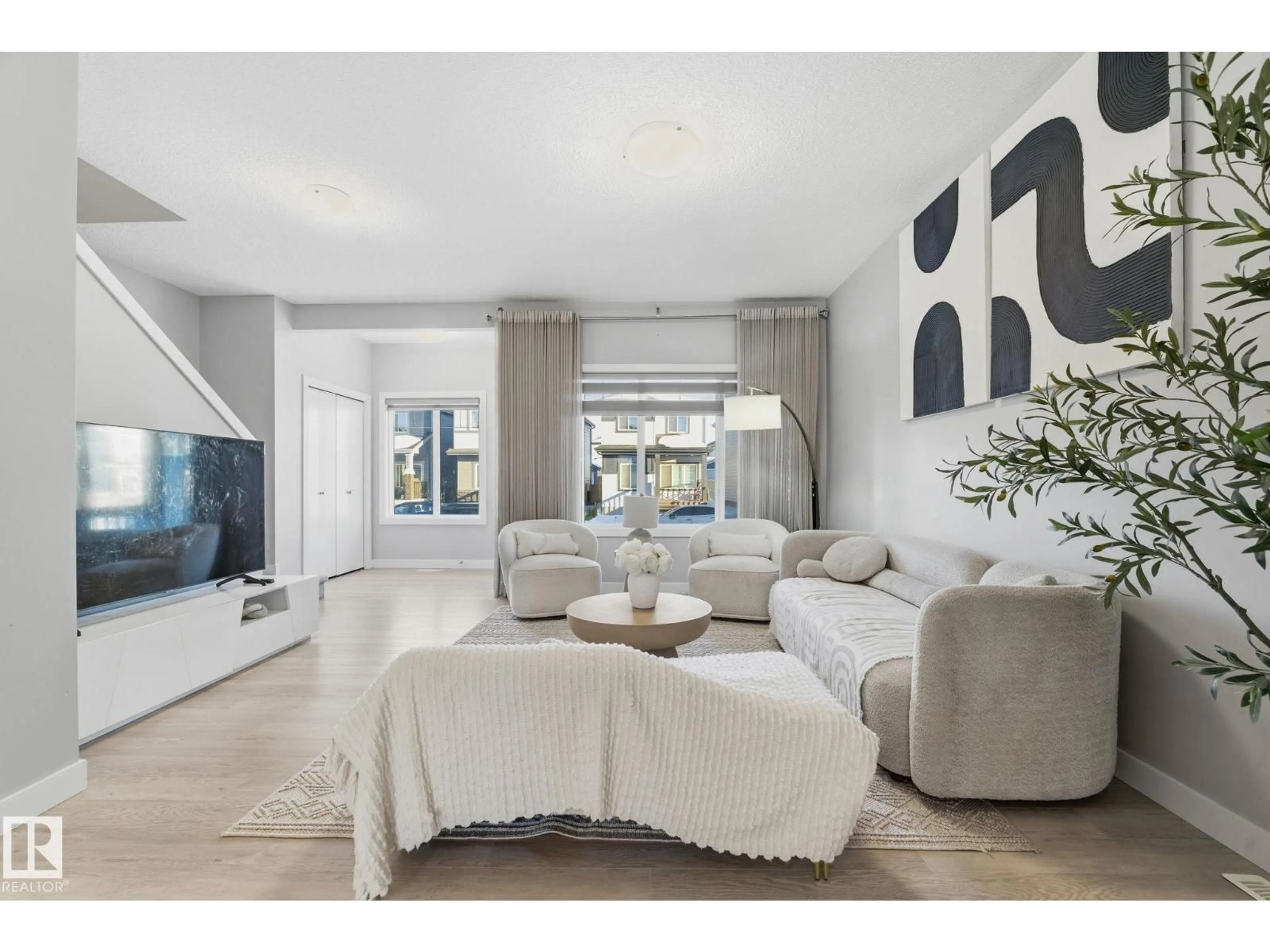 Living room with furniture, ceramic/tile floor for 17940 62 ST, Edmonton Alberta T5Y4A6