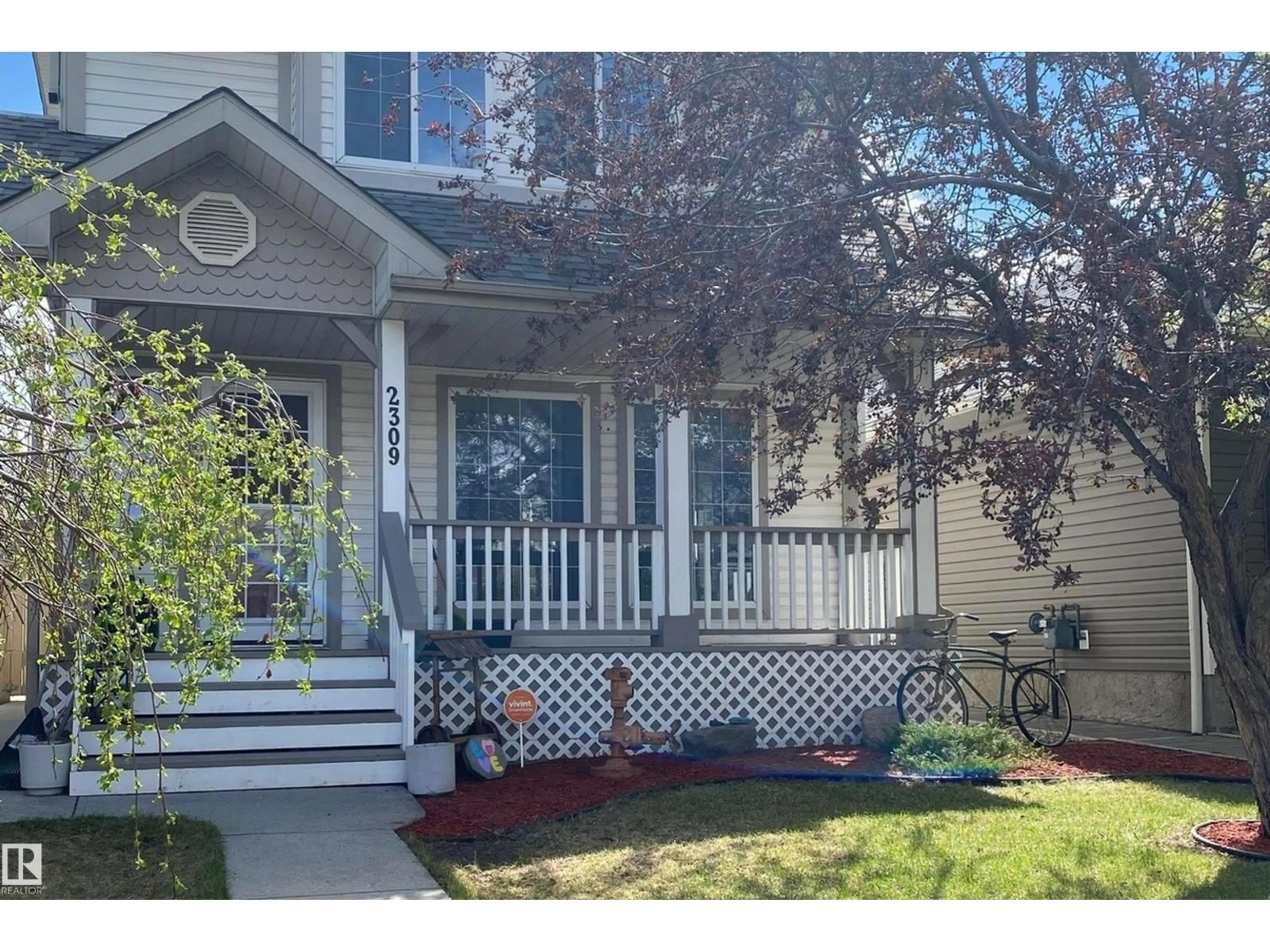 Home with vinyl exterior material, street for NW - 2309 39 AV, Edmonton Alberta T6T1K7