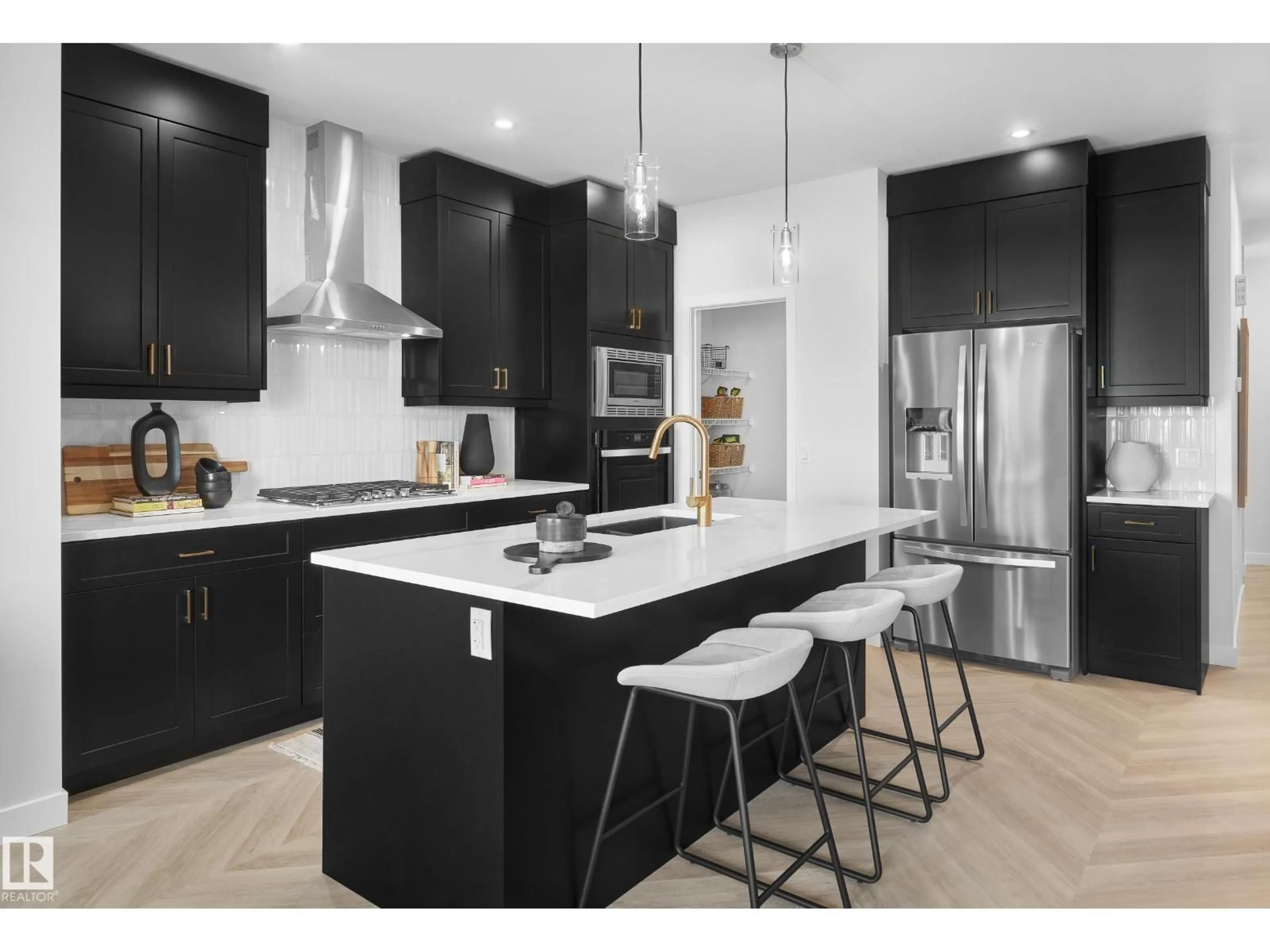 Open concept kitchen, wood/laminate floor for 2126 MUCKLEPLUM CR, Edmonton Alberta T6X3G9