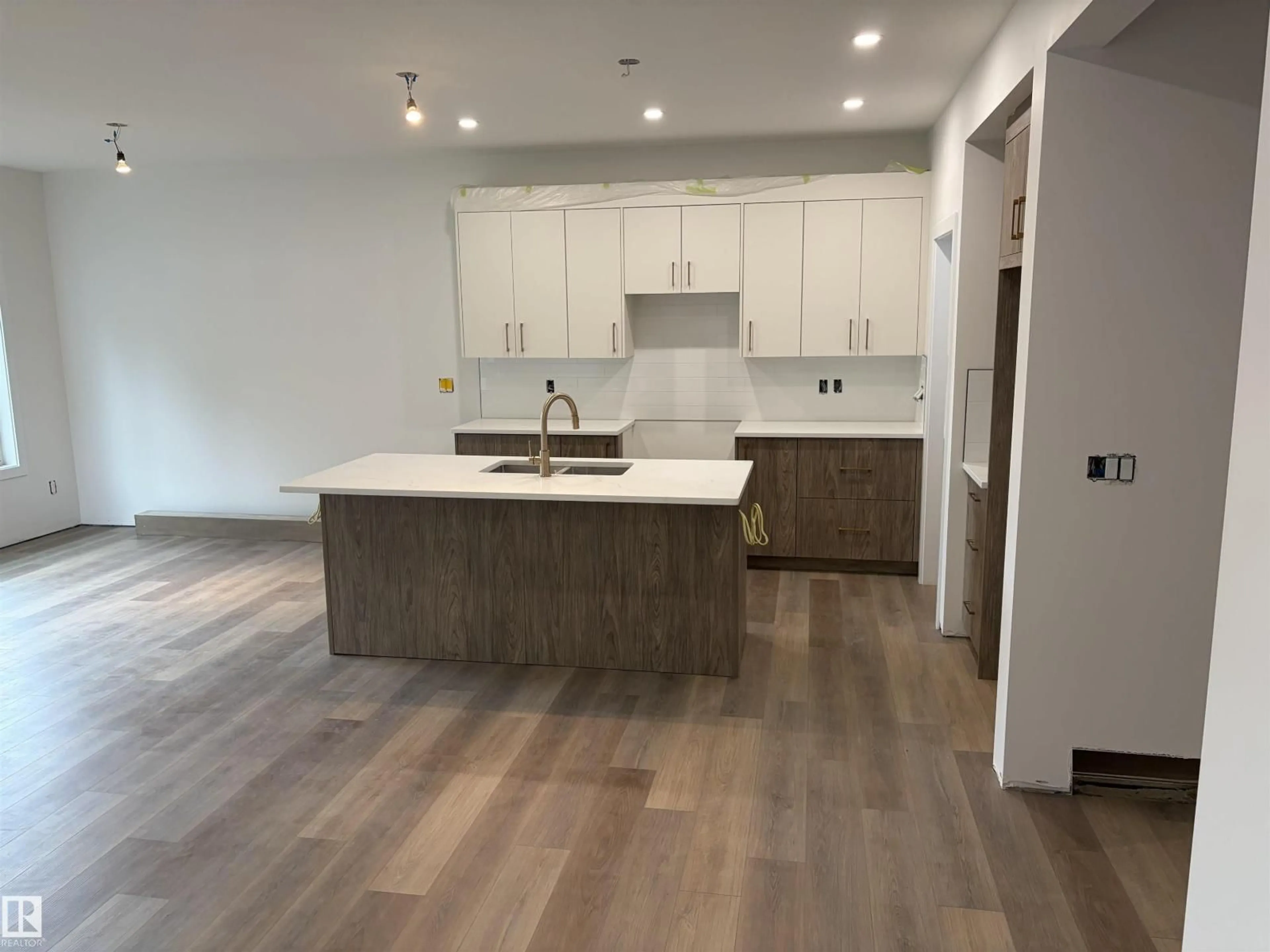 Open concept kitchen, wood/laminate floor for 30 ELSINORE PL, Edmonton Alberta T5X0M6