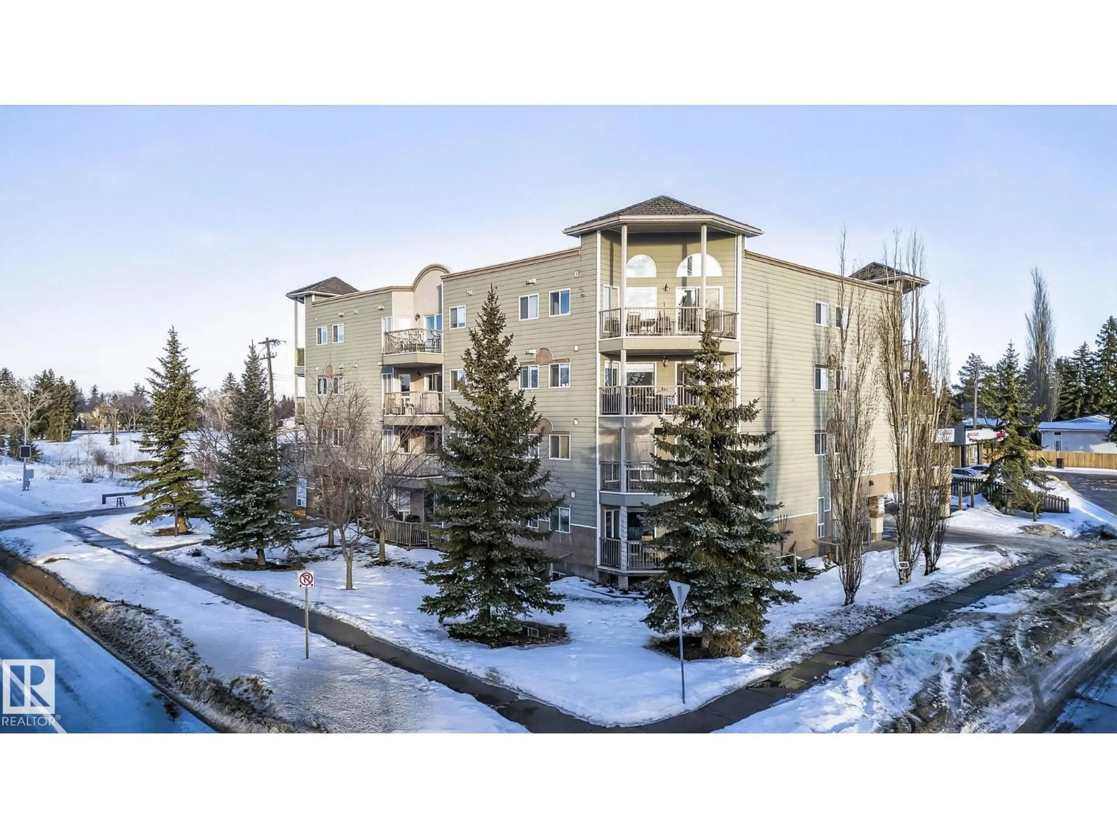 A pic from outside/outdoor area/front of a property/back of a property/a pic from drone, mountain view for #404 - 11207 116 ST, Edmonton Alberta T5G3K5