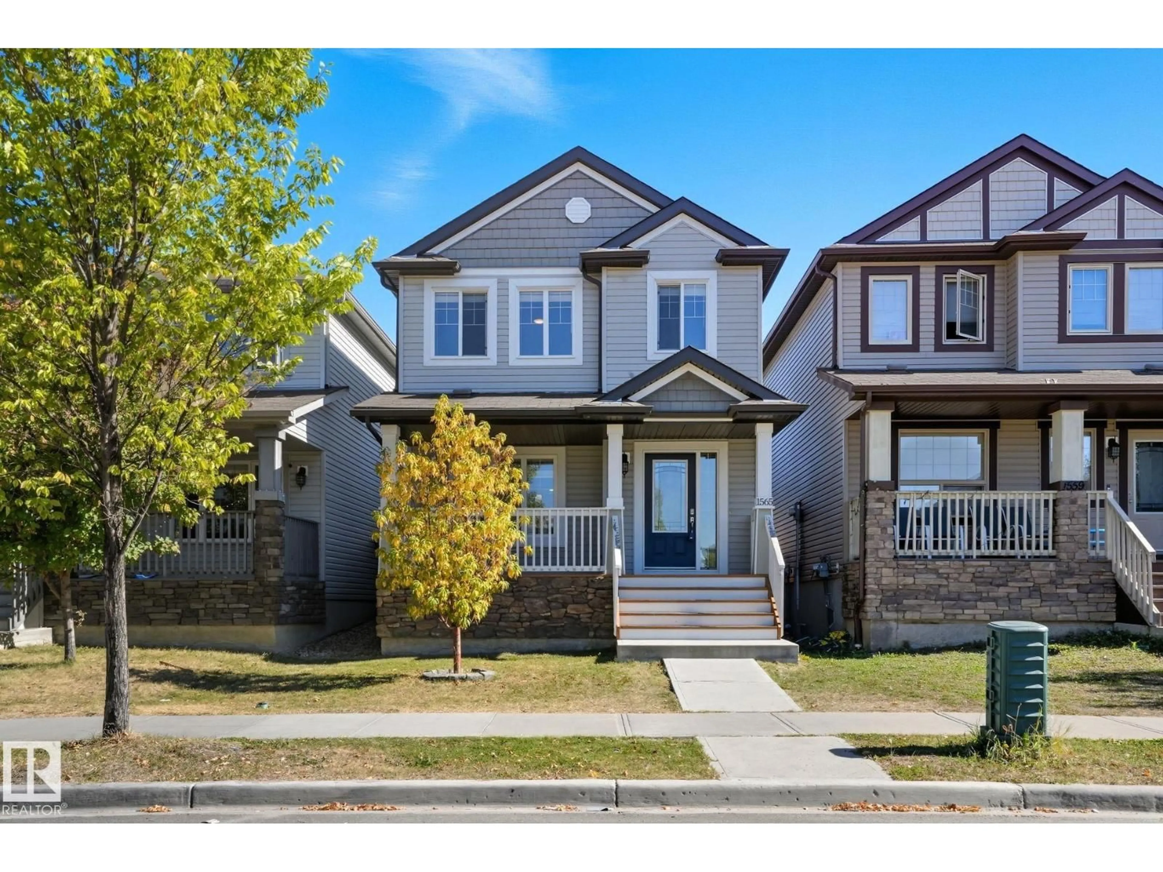 Home with vinyl exterior material, street for NW - 1565 33A ST, Edmonton Alberta T6T0X5