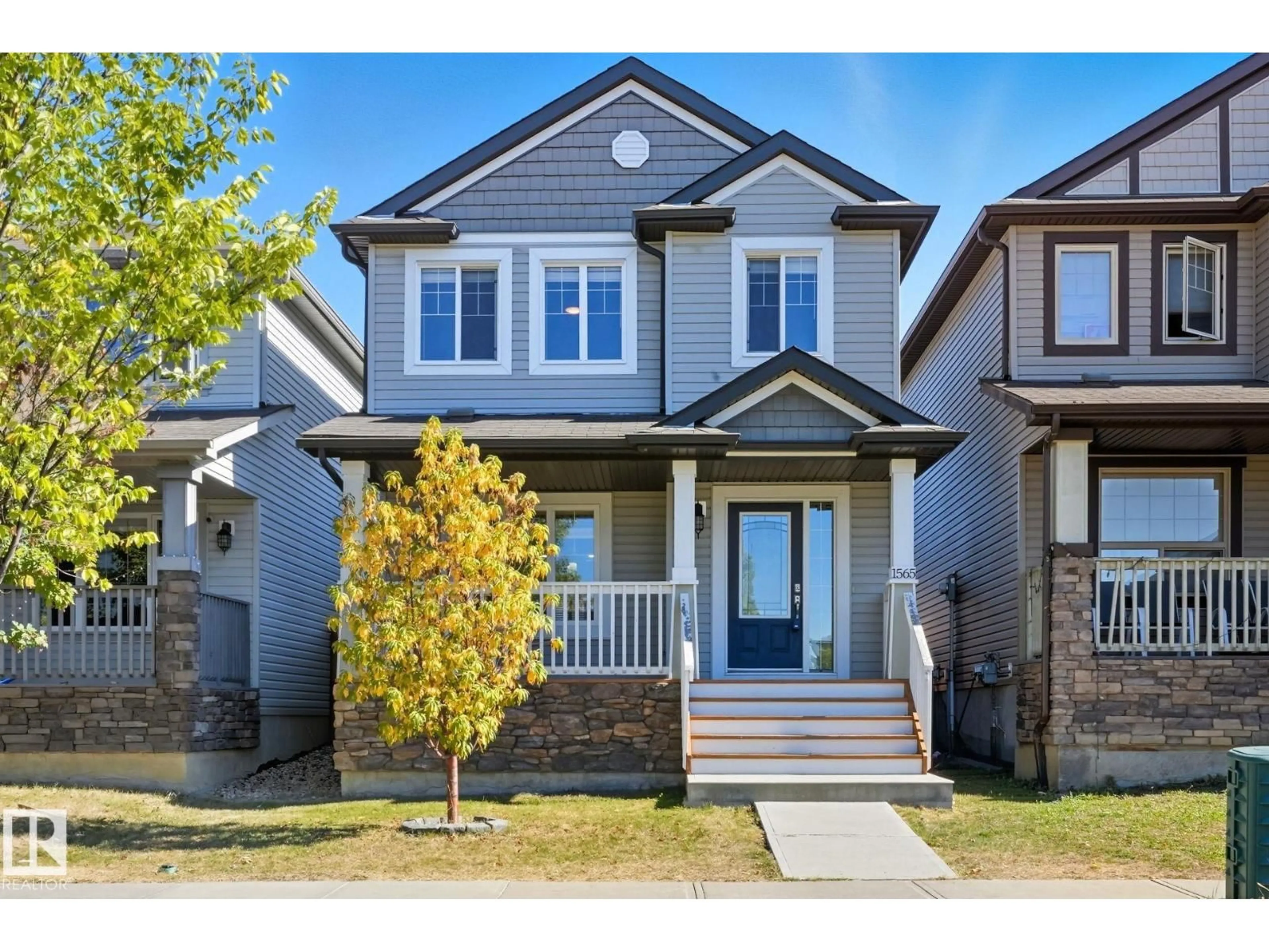 Home with vinyl exterior material, street for NW - 1565 33A ST, Edmonton Alberta T6T0X5