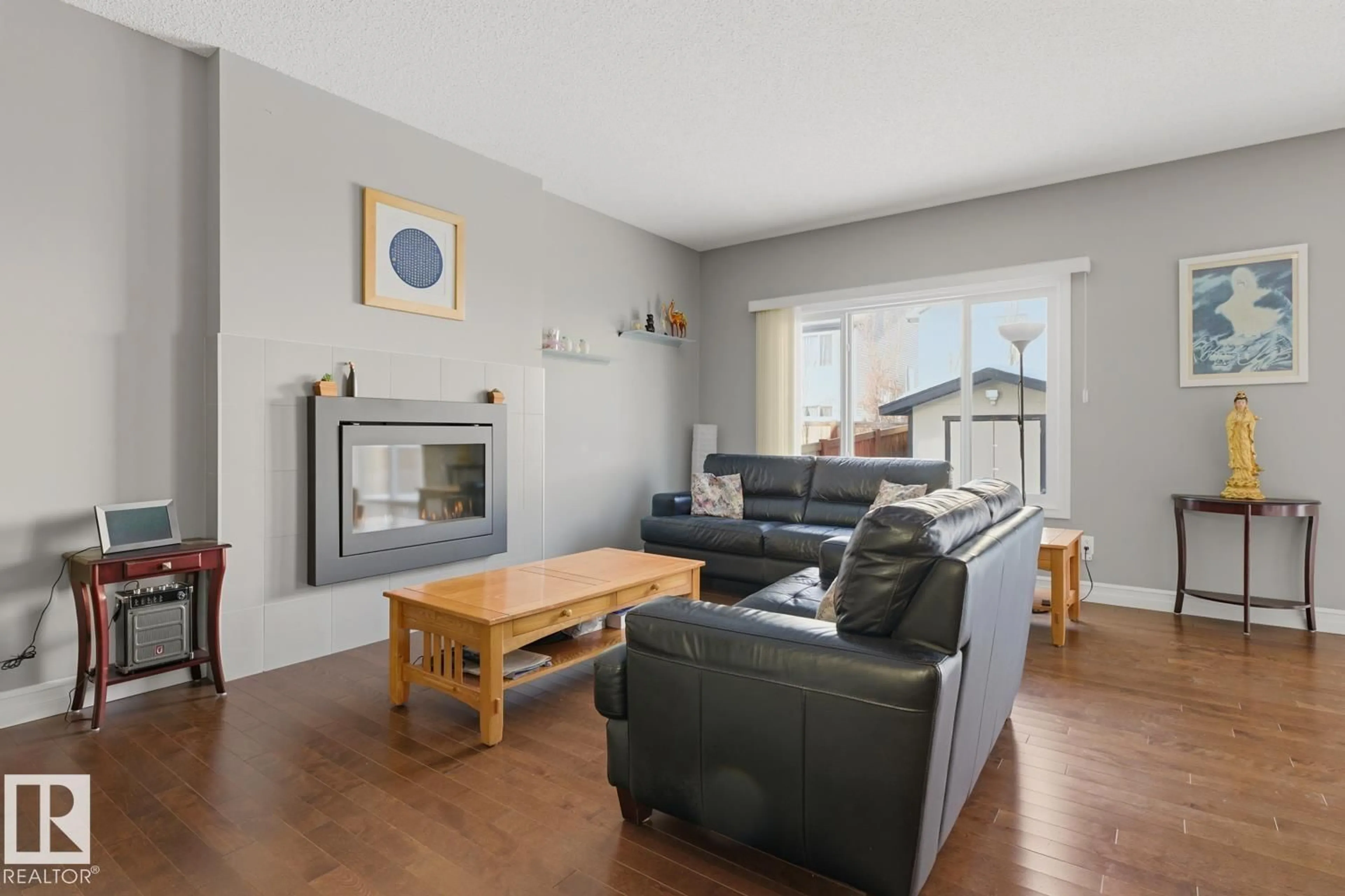 Living room with furniture, wood/laminate floor for NW - 12244 167B AV, Edmonton Alberta T5X0G7