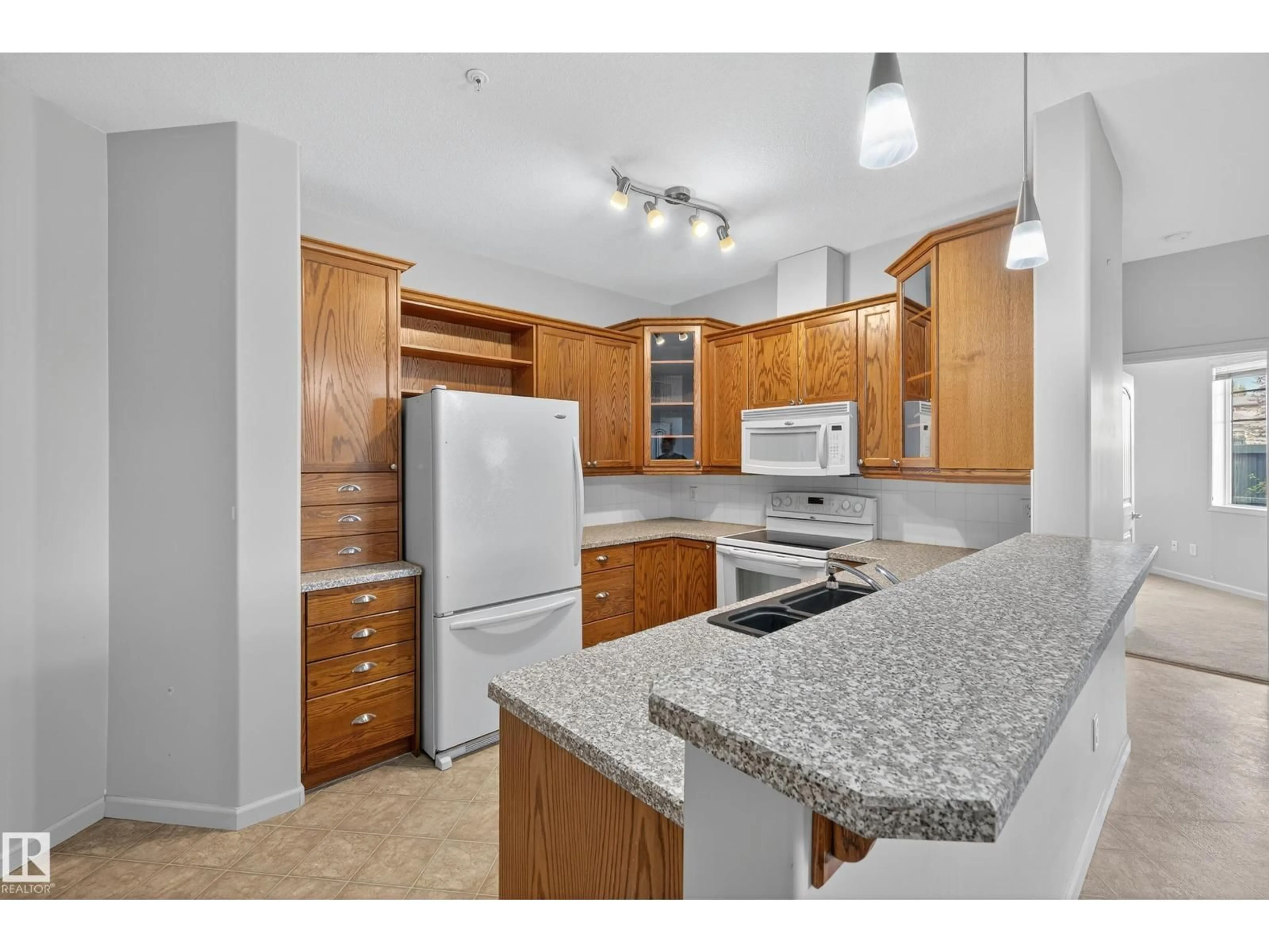 Standard kitchen, ceramic/tile floor for #112 - 2503 HANNA CR, Edmonton Alberta T6R0H1
