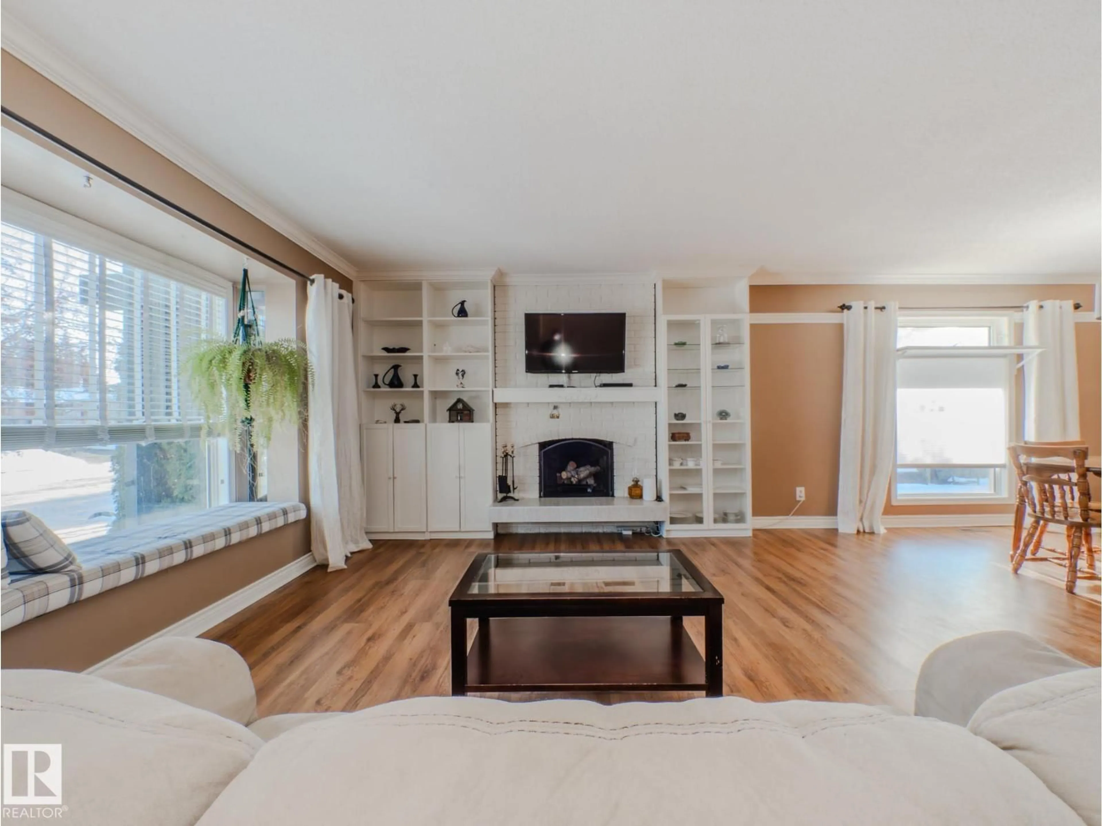 Living room with furniture, wood/laminate floor for NW - 3204 113B ST, Edmonton Alberta T6J3T7