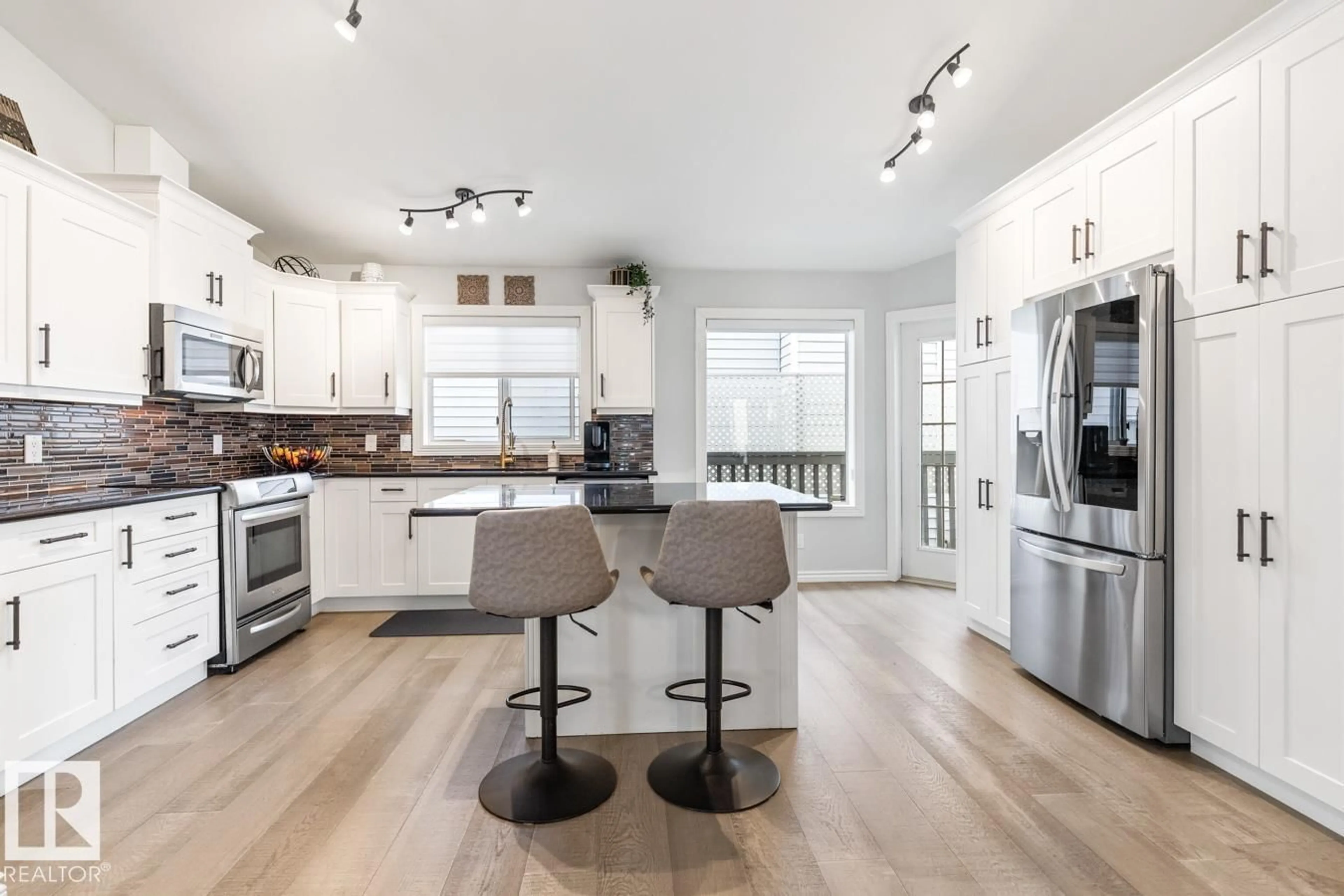 Open concept kitchen, wood/laminate floor for 20 DARLINGTON DR, Sherwood Park Alberta T8H1R8