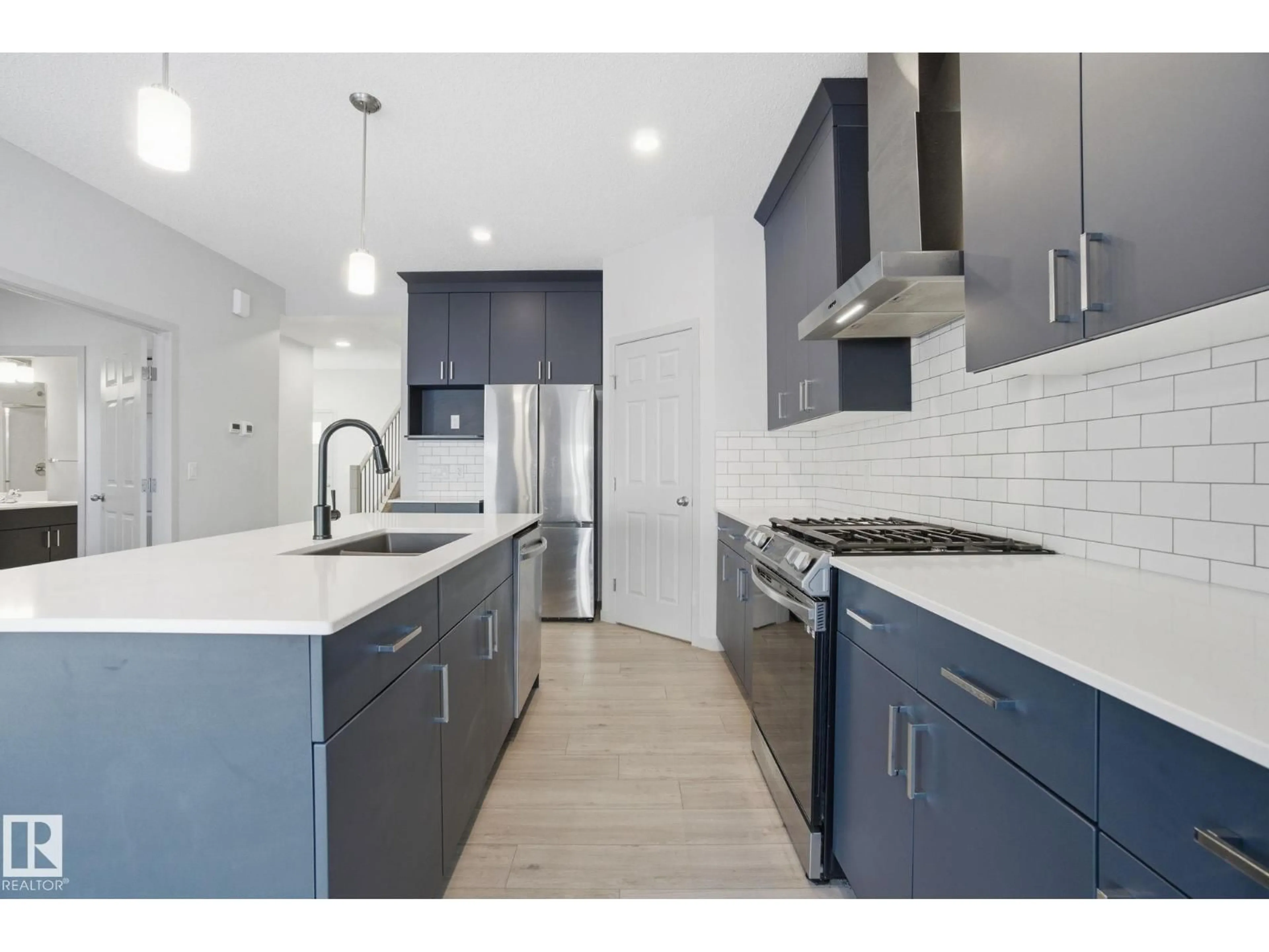 Open concept kitchen, ceramic/tile floor for 2423 194 ST, Edmonton Alberta T6M1P5