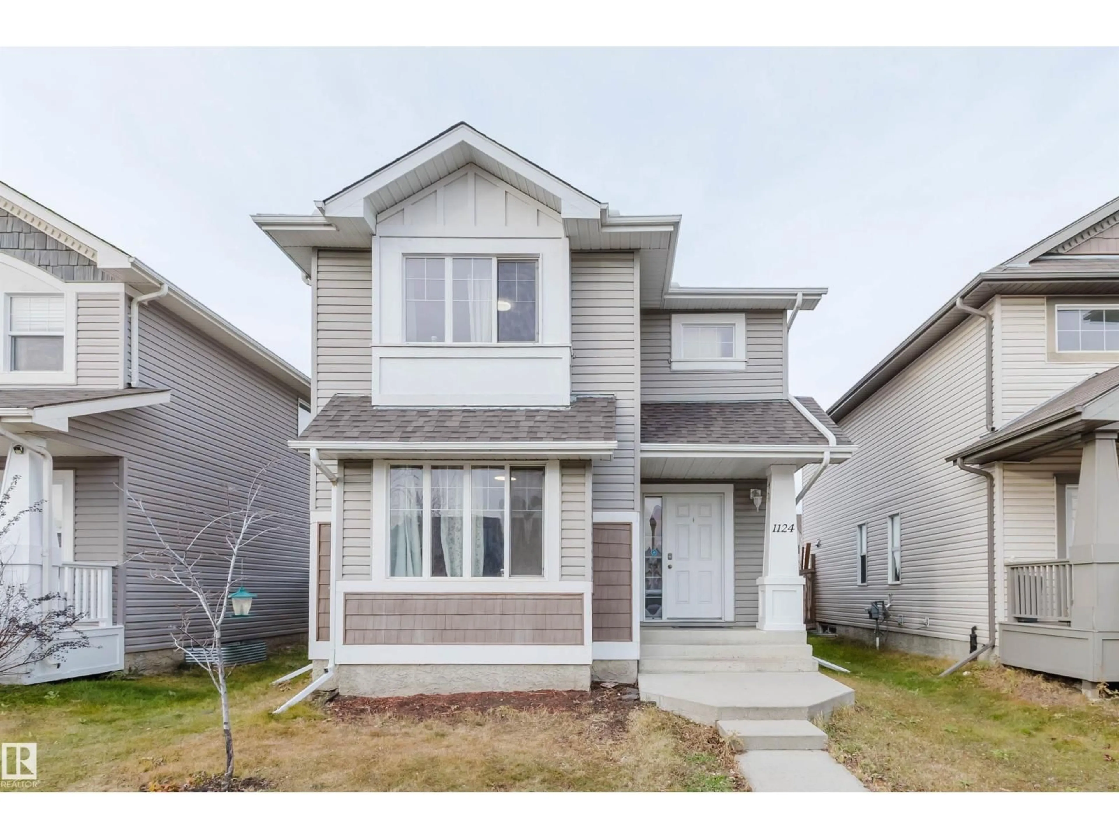 Home with vinyl exterior material, street for 1124 37A AV, Edmonton Alberta T6T0E7