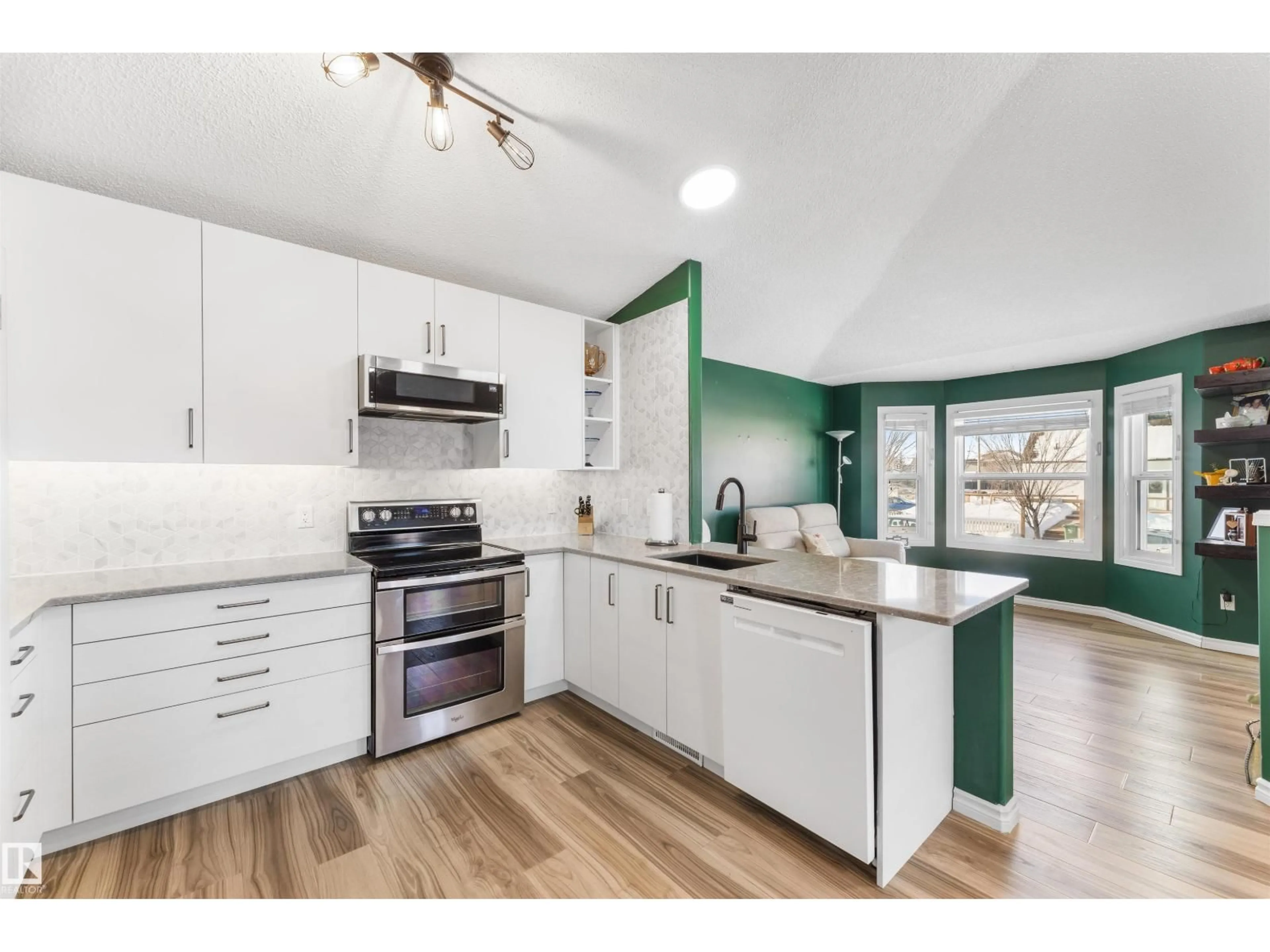 Open concept kitchen, wood/laminate floor for 3117 49, Beaumont Alberta T4X1R6