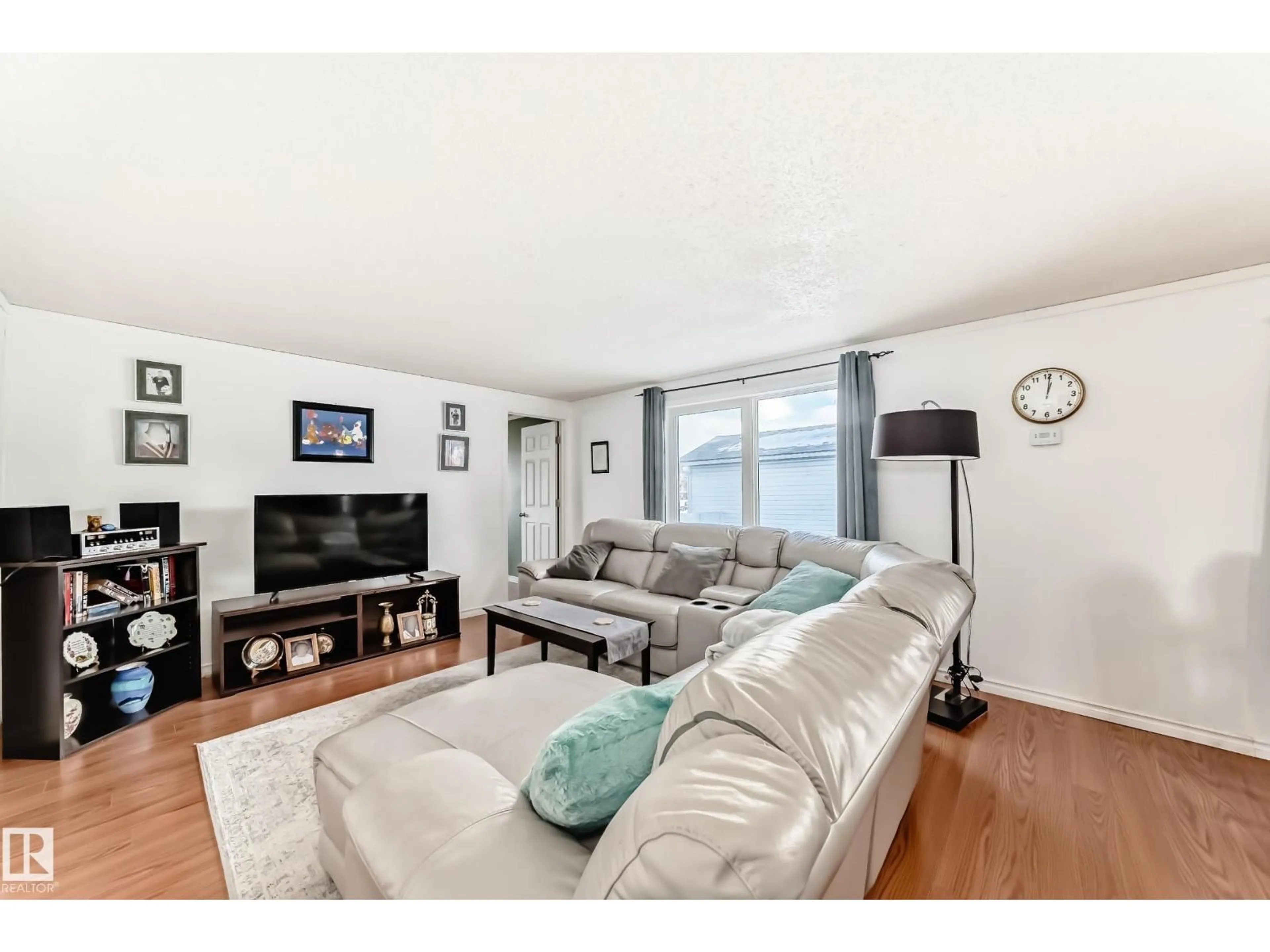 Living room with furniture, wood/laminate floor for 65 WEST VIEW BV, Edmonton Alberta T5S1T5