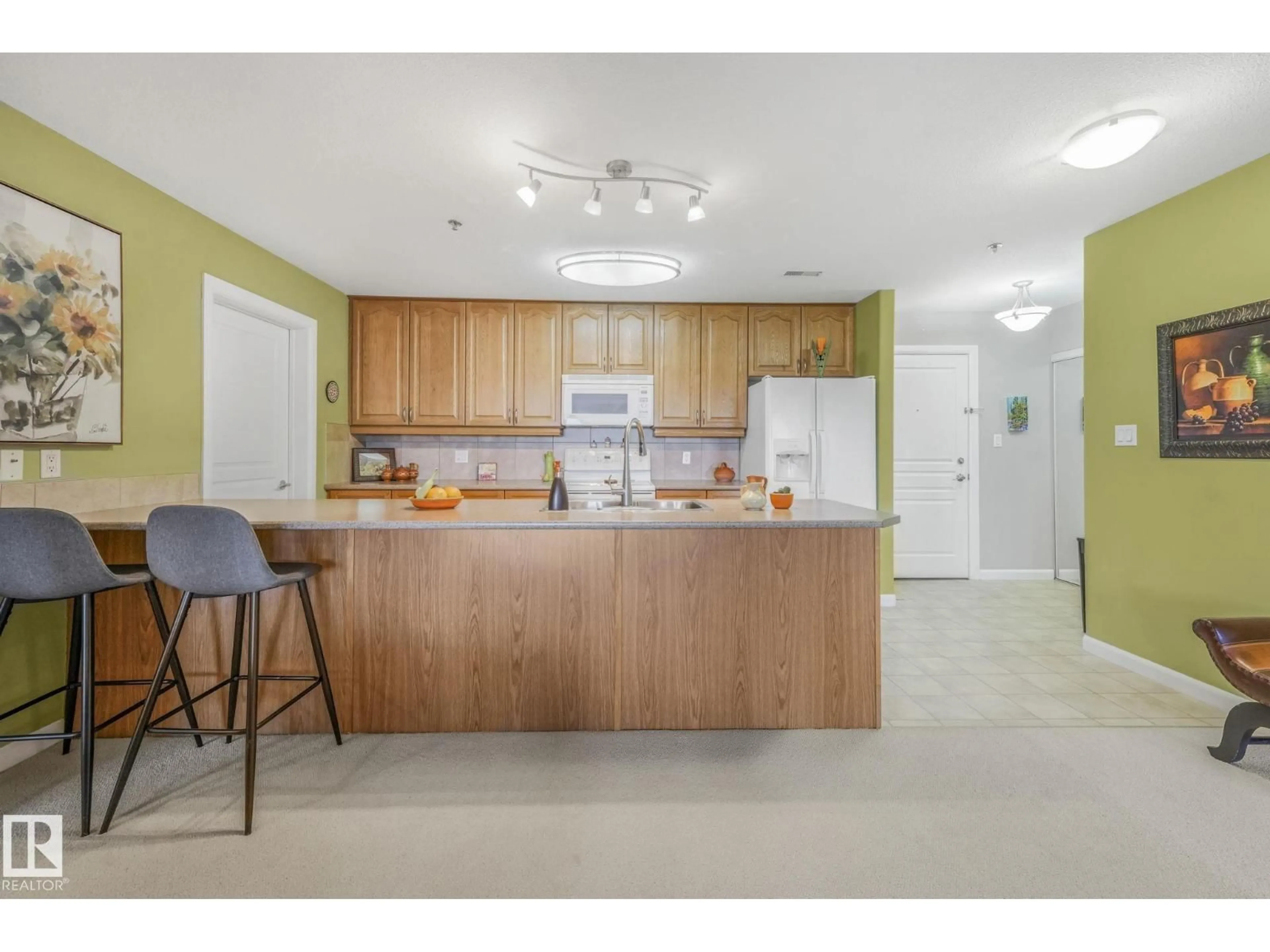 Open concept kitchen, unknown for #415 - 530 HOOKE RD, Edmonton Alberta T5A5J5