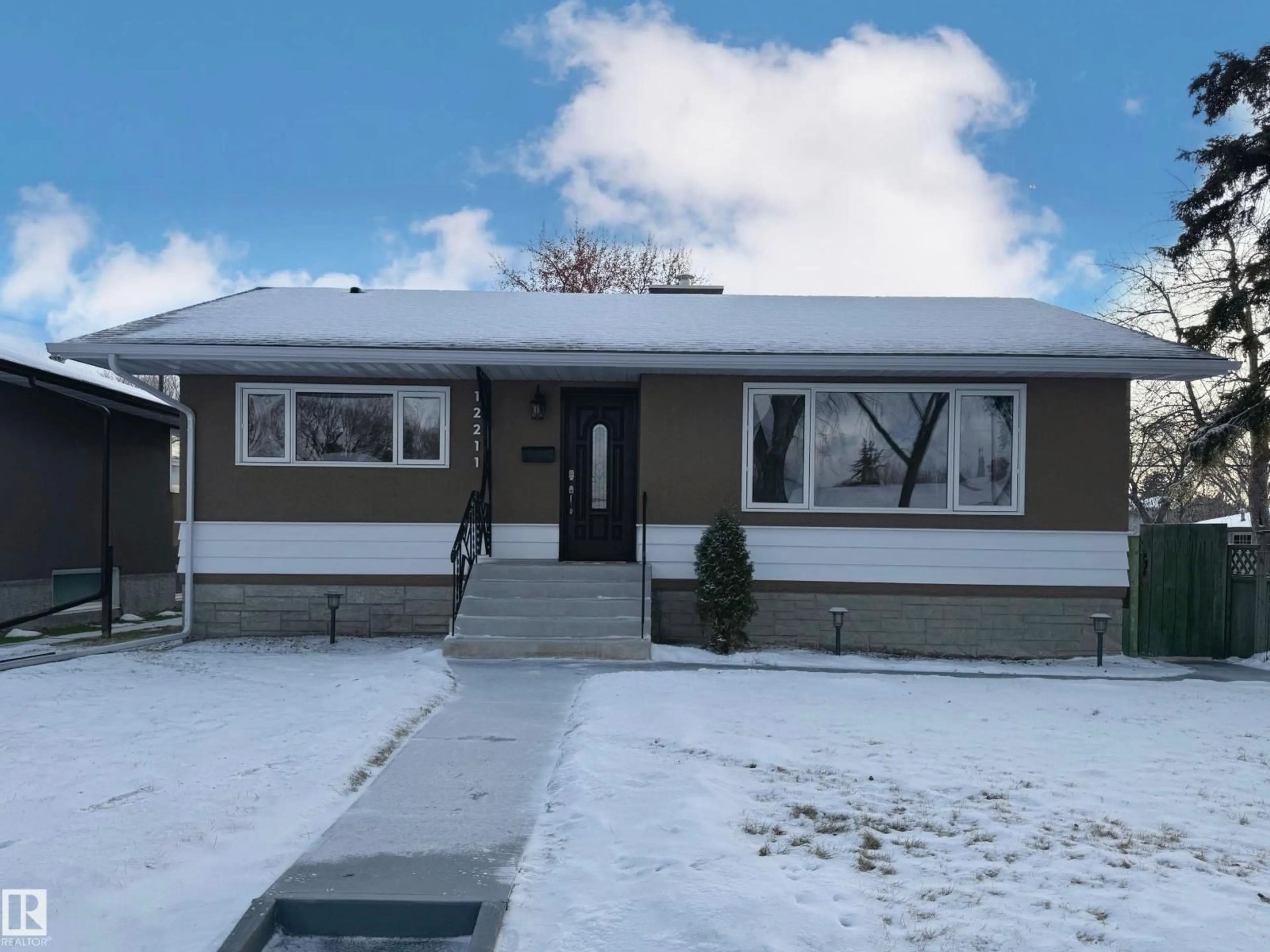 Home with vinyl exterior material, street for NW - 12211 52 ST, Edmonton Alberta T5W3K3