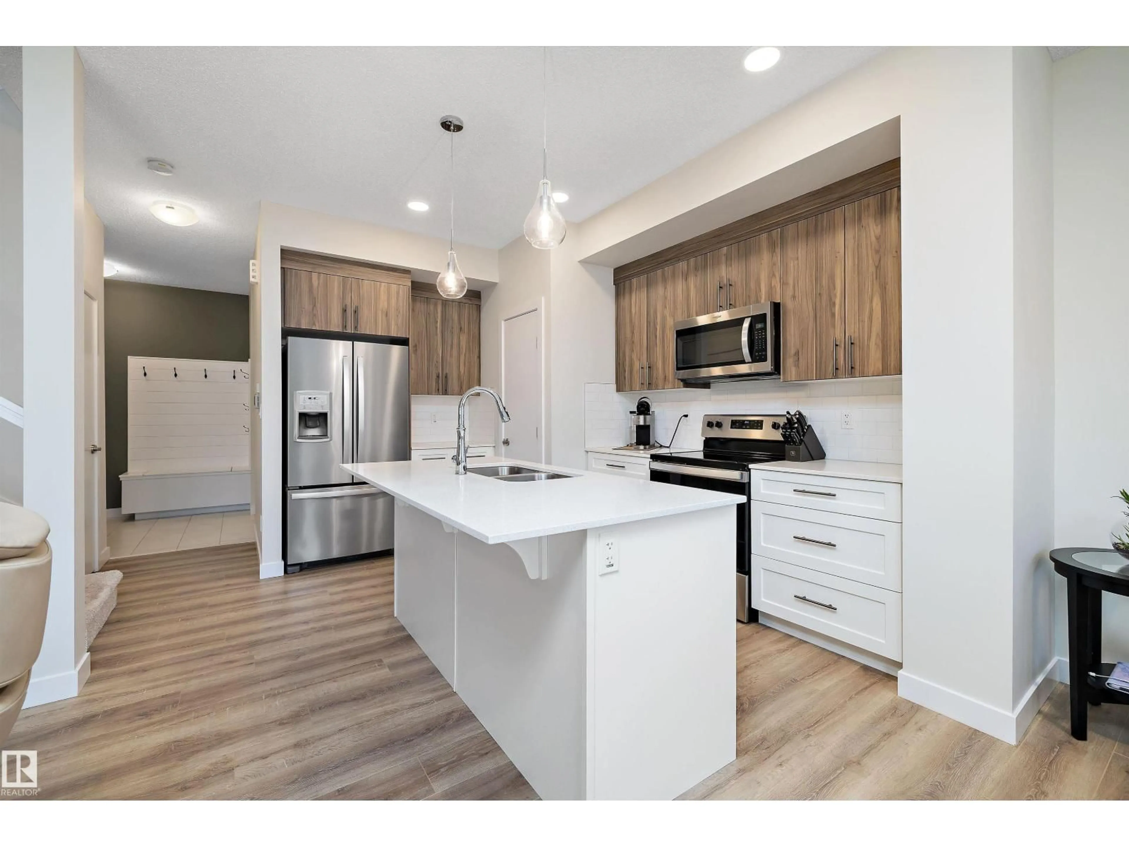 Open concept kitchen, wood/laminate floor for 73 GARNEAU GA, Spruce Grove Alberta T7X0Z7