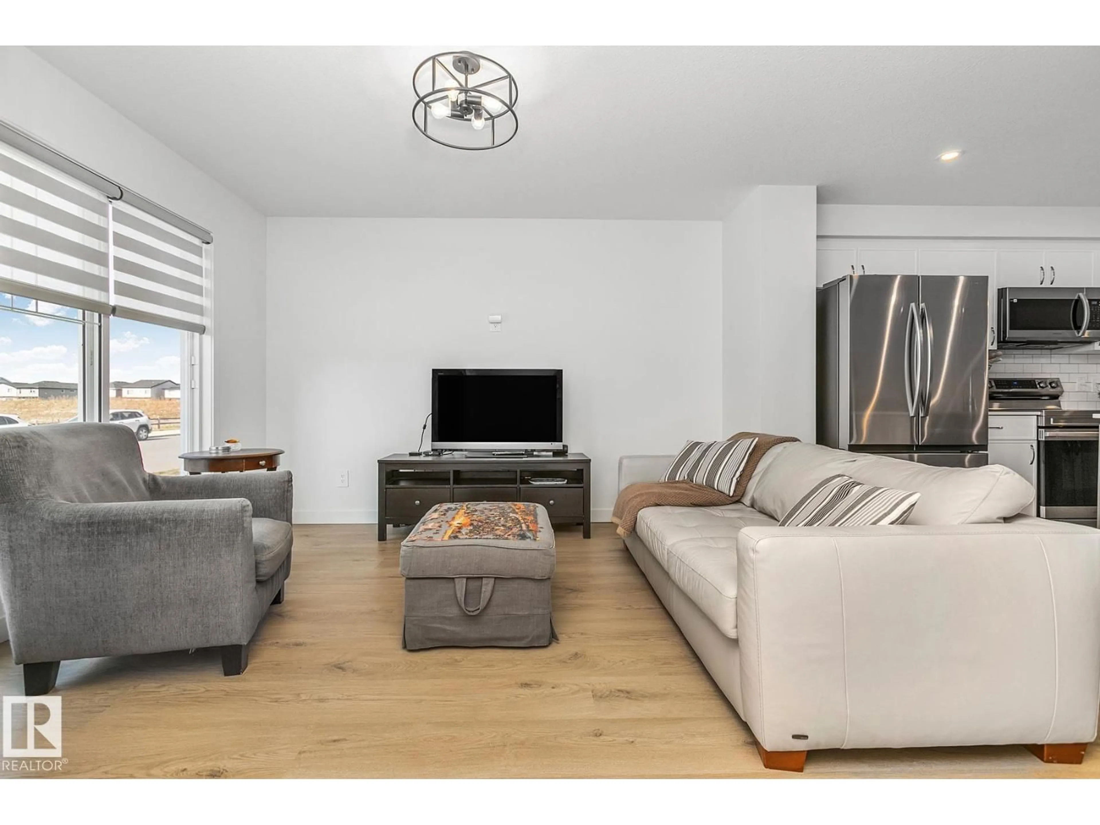 Living room with furniture, wood/laminate floor for 17919 71 ST, Edmonton Alberta T5Z0V4