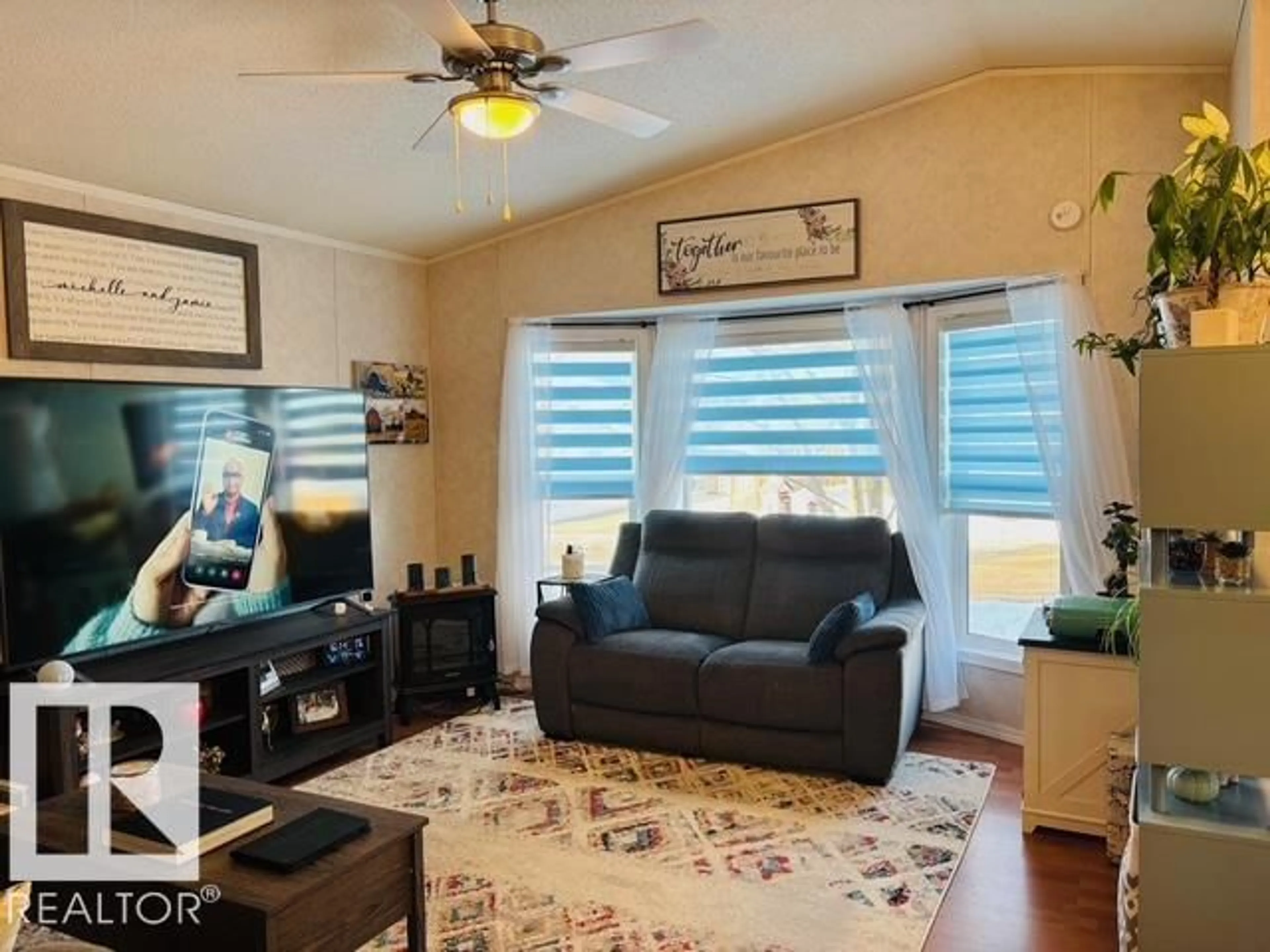 Living room with furniture, wood/laminate floor for 245 OAK WOOD DRIVE, Edmonton Alberta T6P0A4